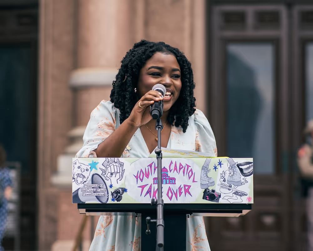 SEAT organizer Aihanuwa speaking at the Youth Capitol Takeover