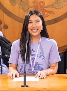 SEAT advocate at a microphone podium