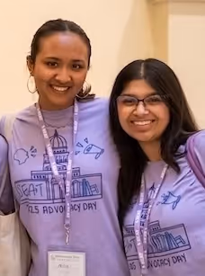 SEAT organizers smiling and wearing purple Advocacy Day shirts