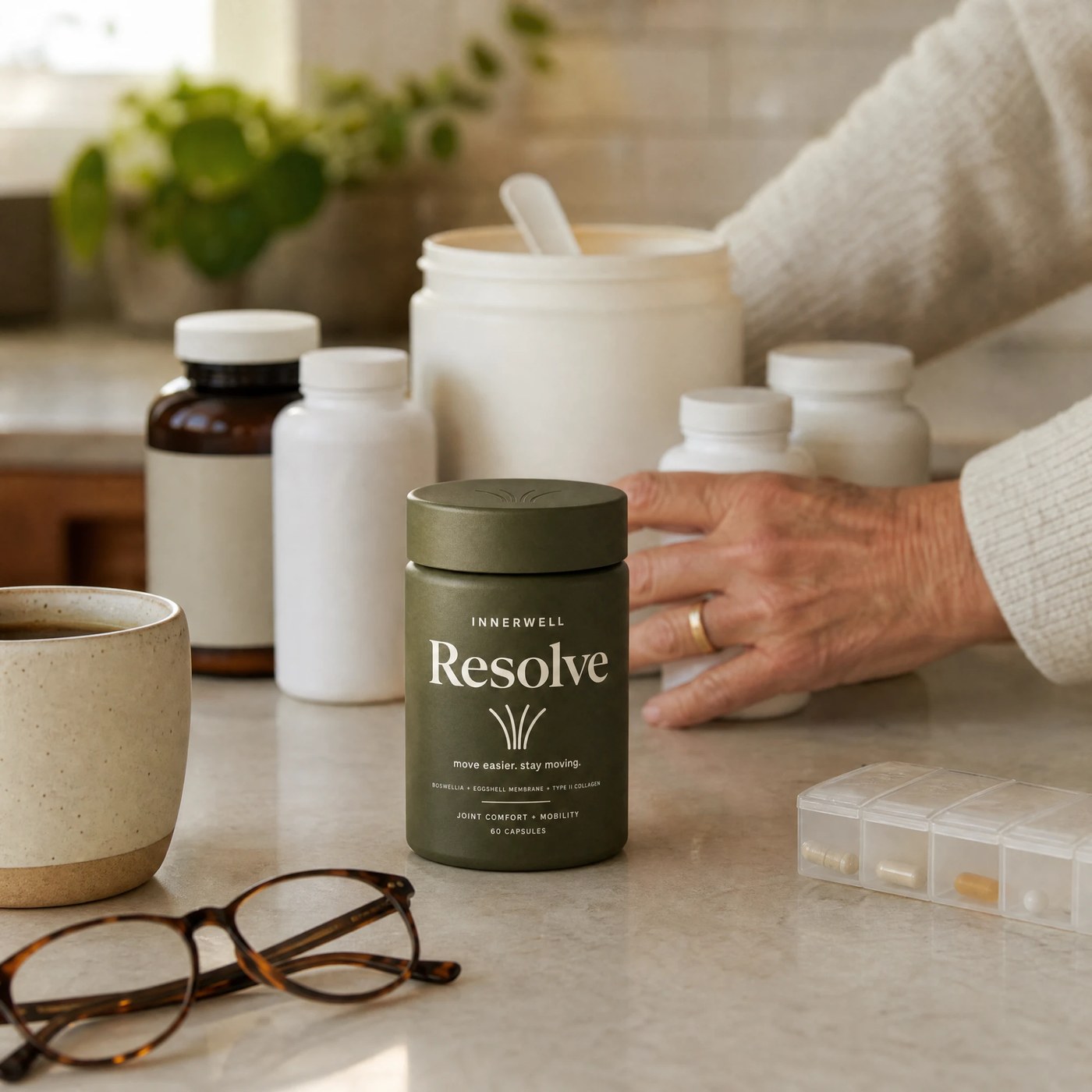 Resolve beside an assortment of other joint supplement bottles and powders