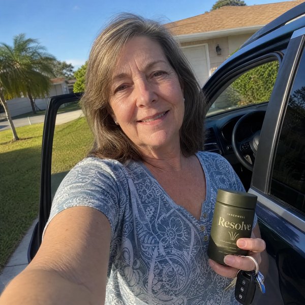 Carol Bennett beside her car holding InnerWell Resolve