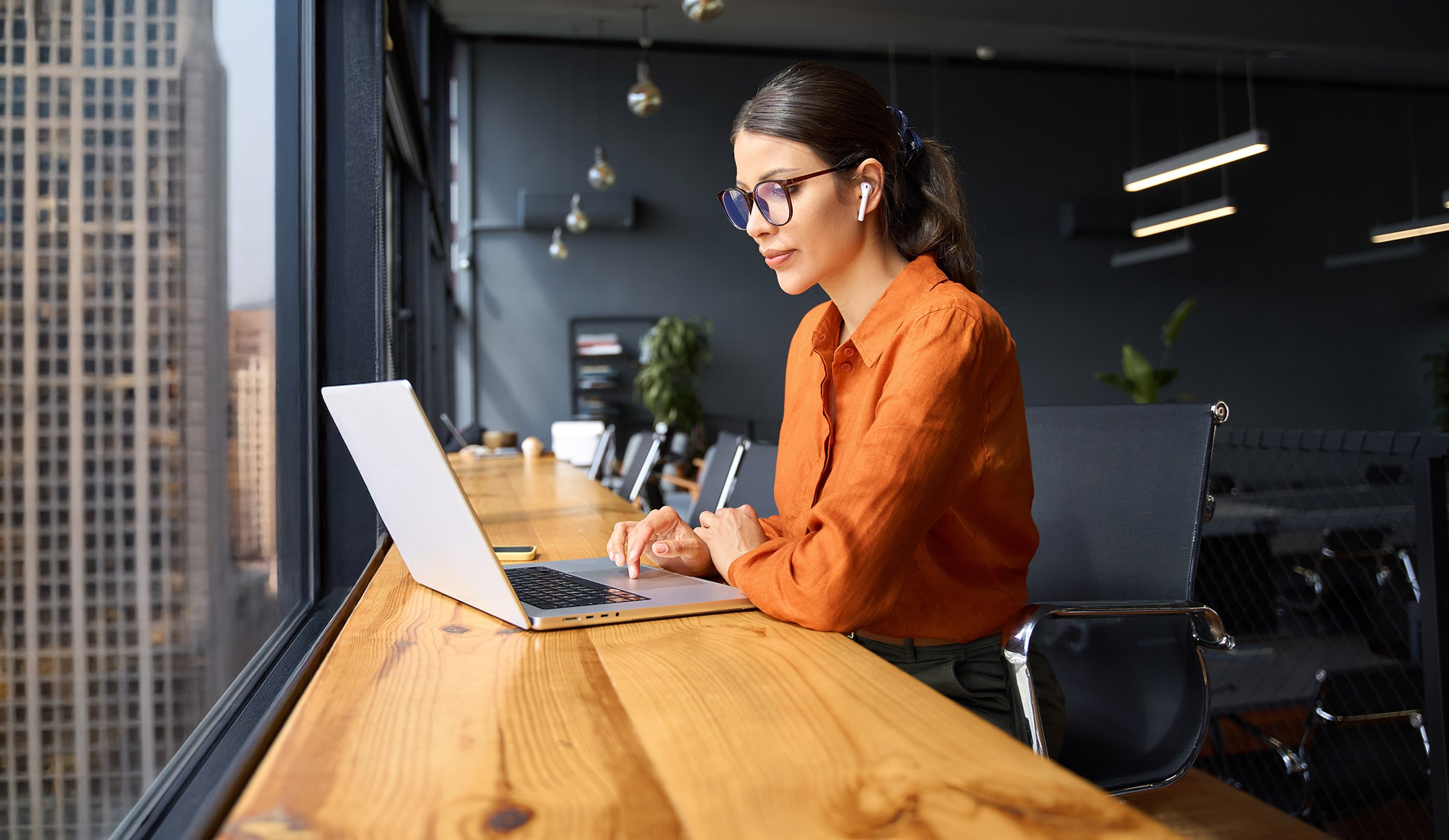 [background image] image of a work desk with a laptop and documents (for a ai legal tech company)