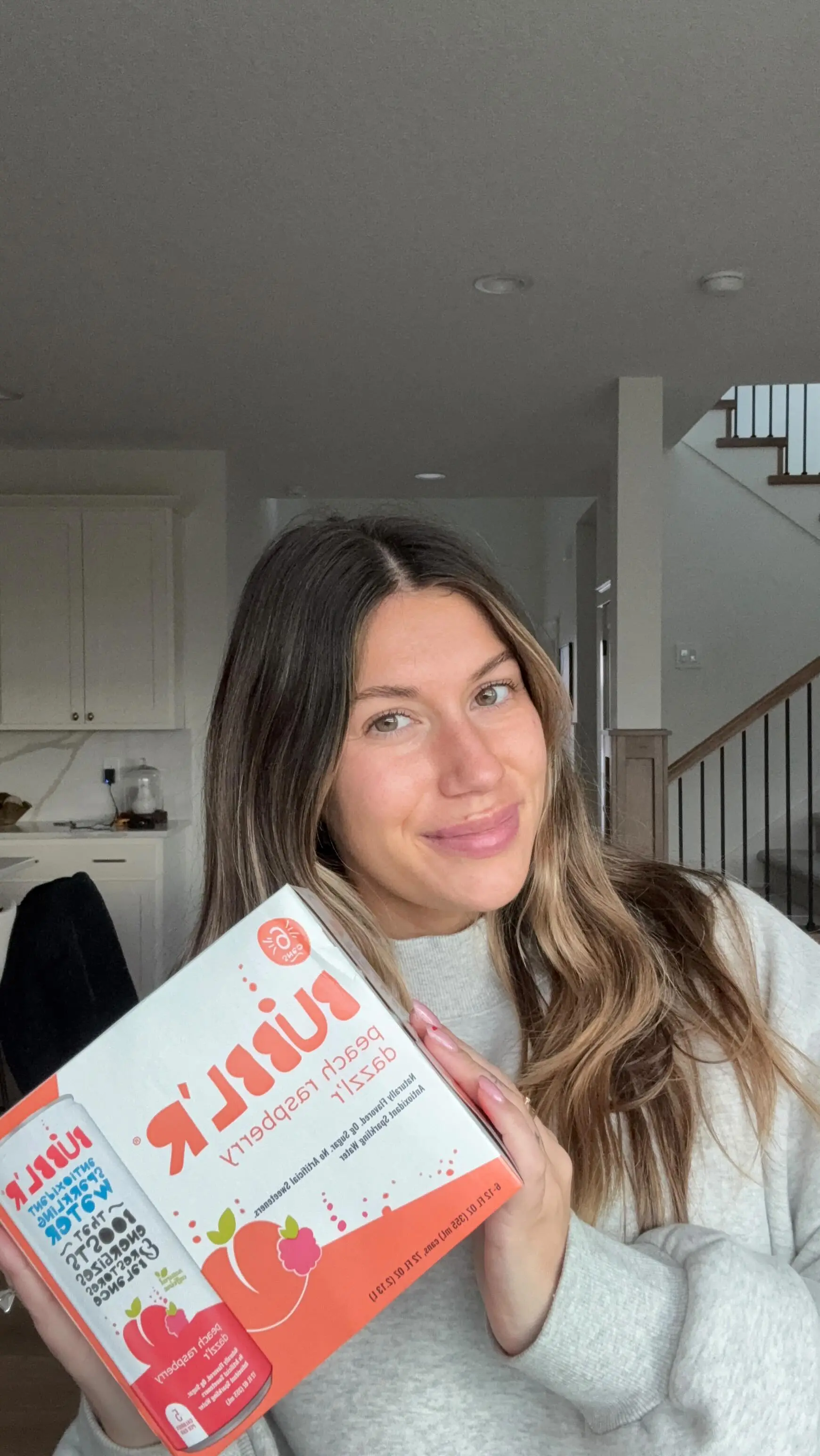 Everyday creator holding Bubblr sparkling water