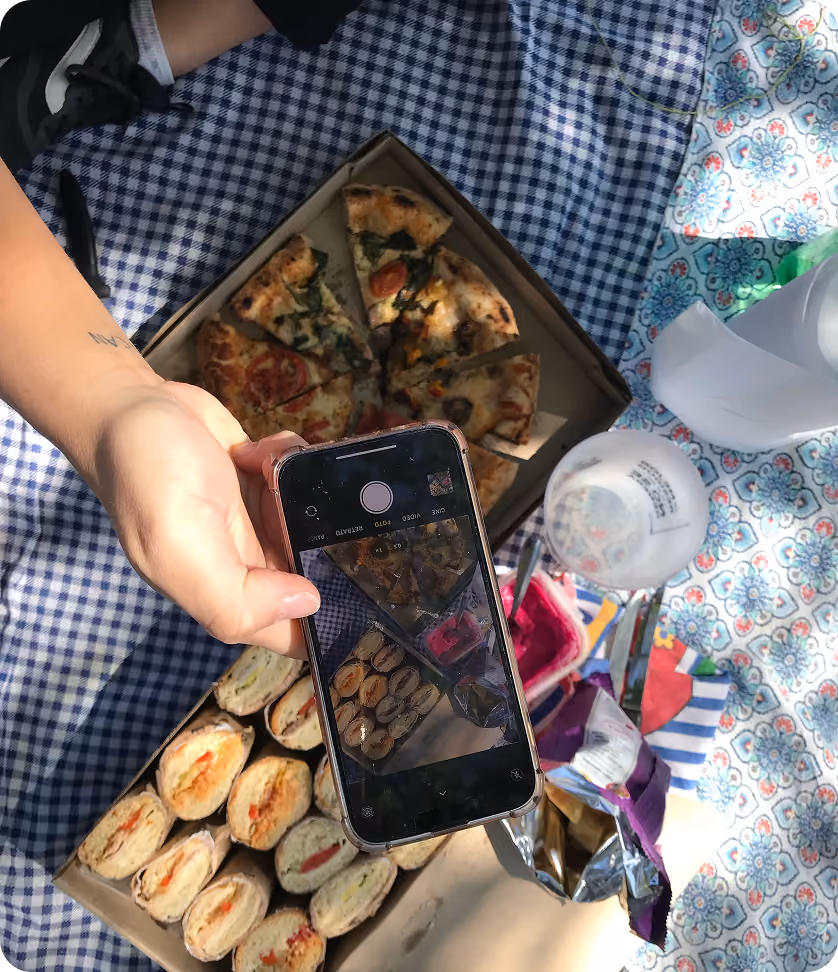 People sharing a meal and taking photos