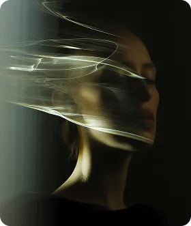 Side profile of a woman with eyes closed illuminated by flowing light streaks against a dark background.