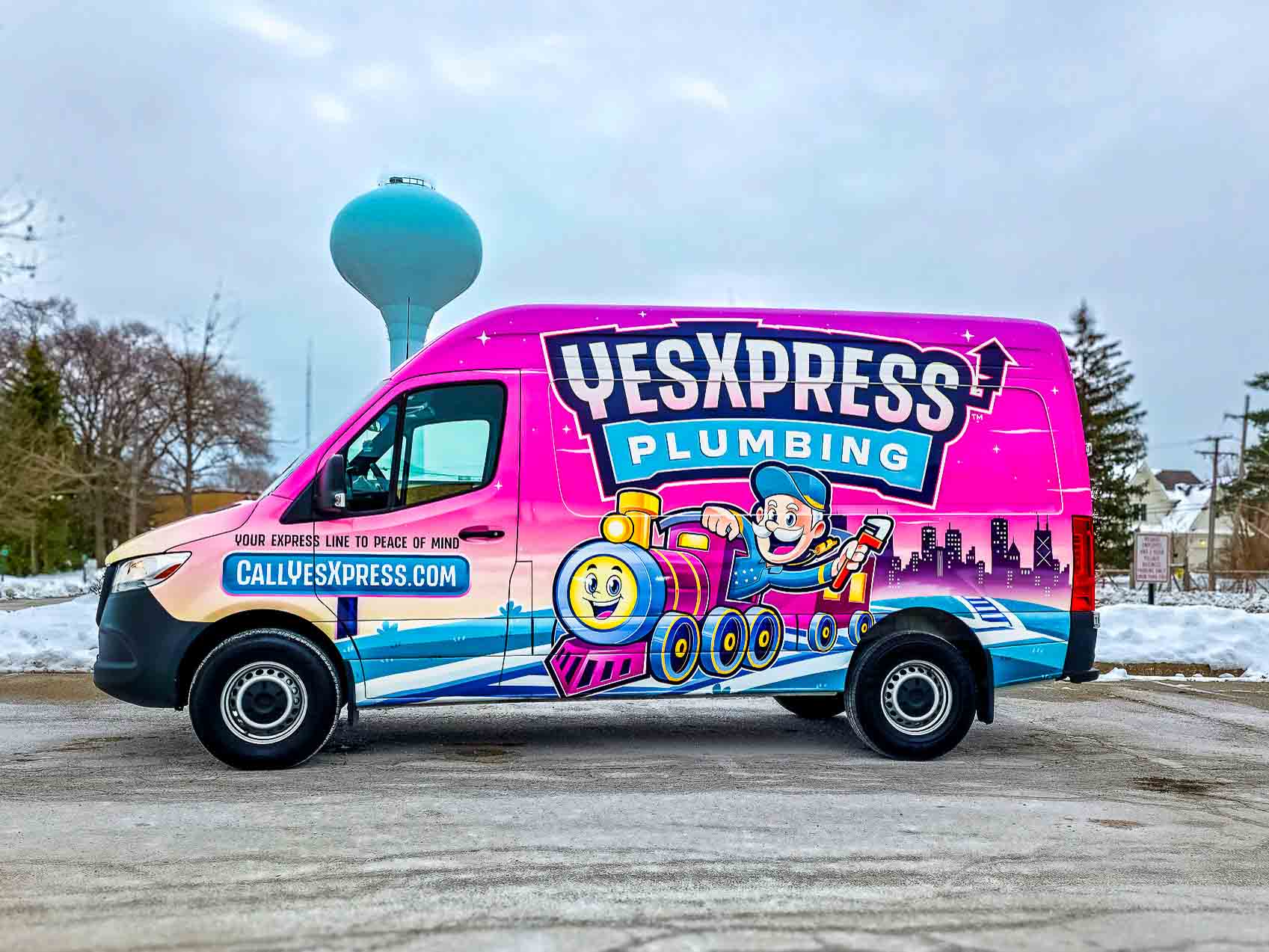 YesXpress Plumbing's service van in front of the Northbrook, IL water tower - your local plumber