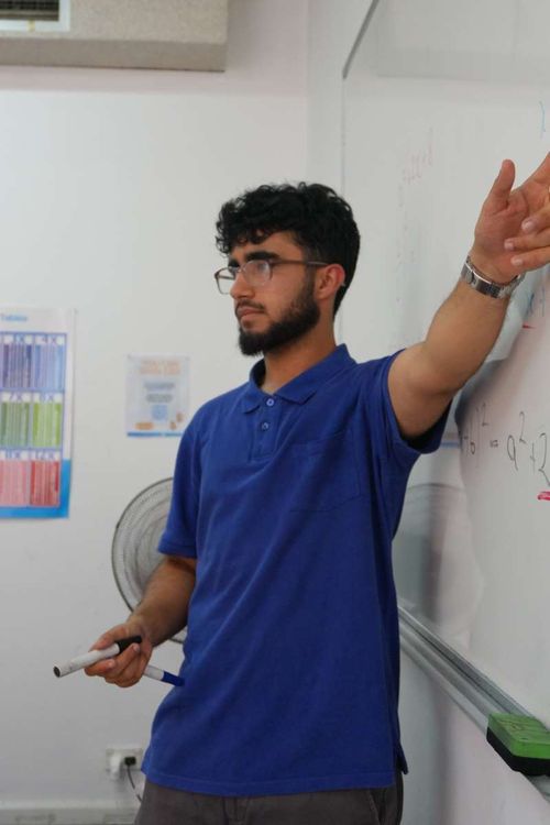 Saarang Ali teaching the class