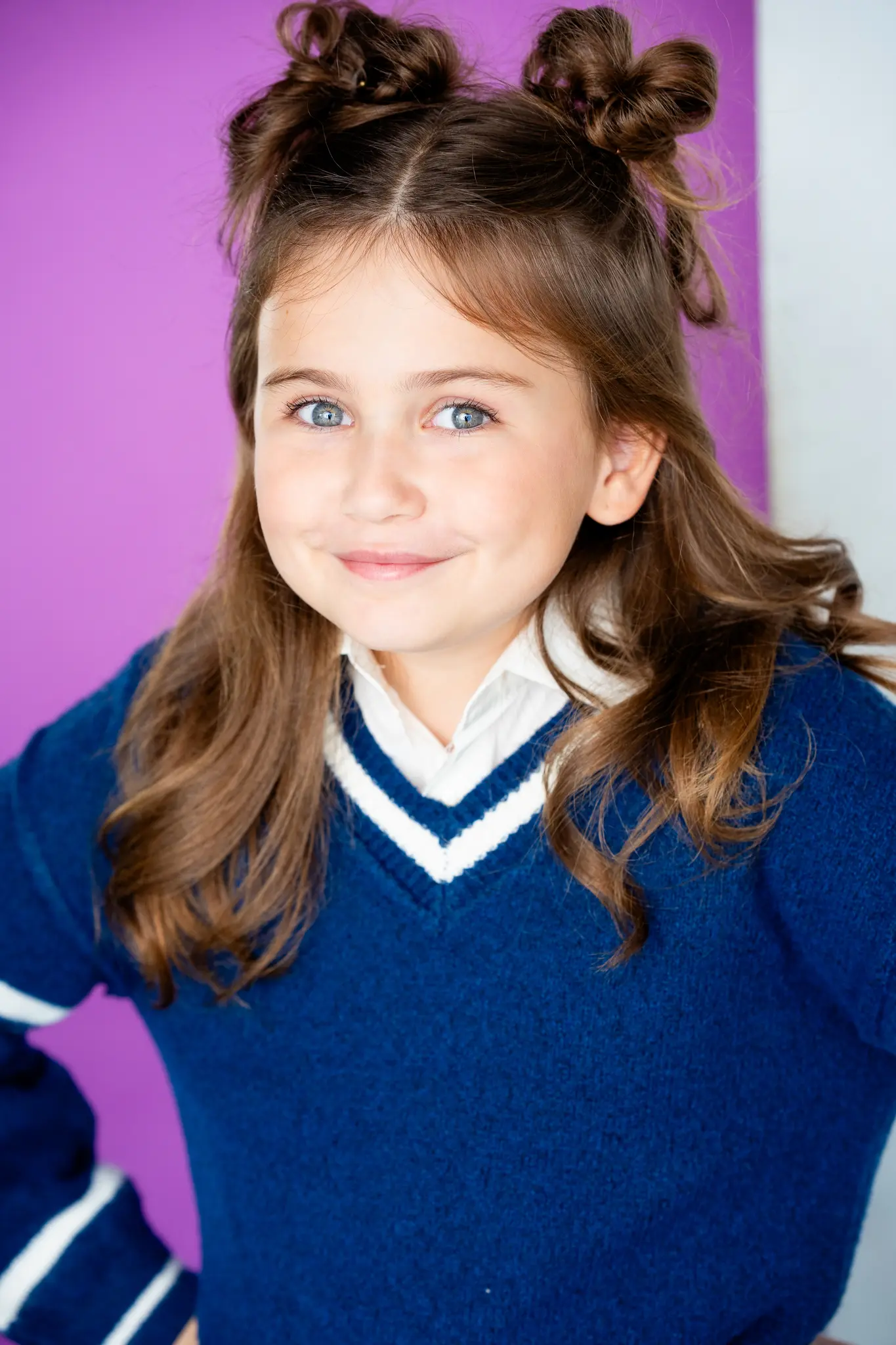 Caroline Brauner child actress commercial headshot with bright expression and studio lighting