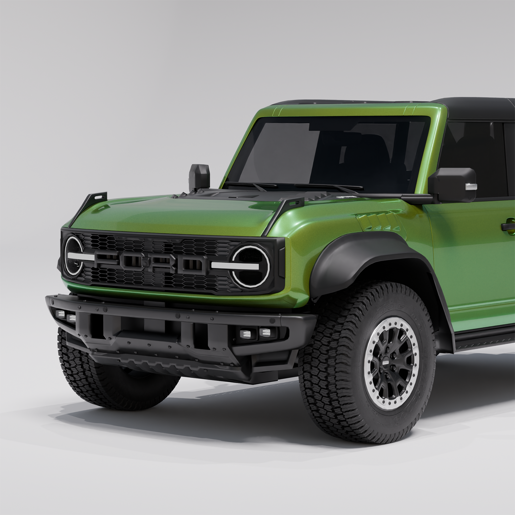 Man applying black vinyl wrap to a car door using a pink squeegee tool.