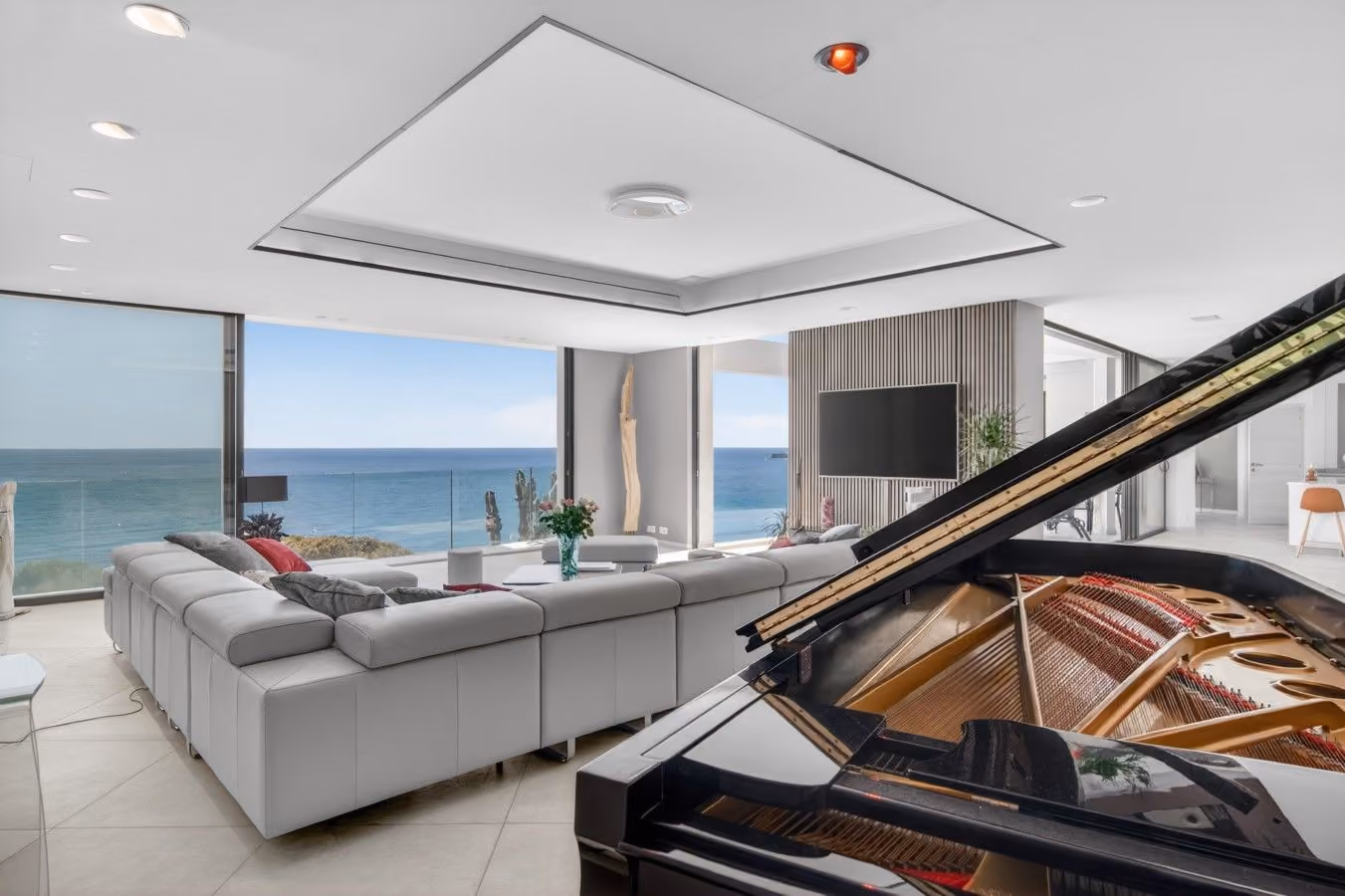 Penthouse lounge with a grand piano over the sea