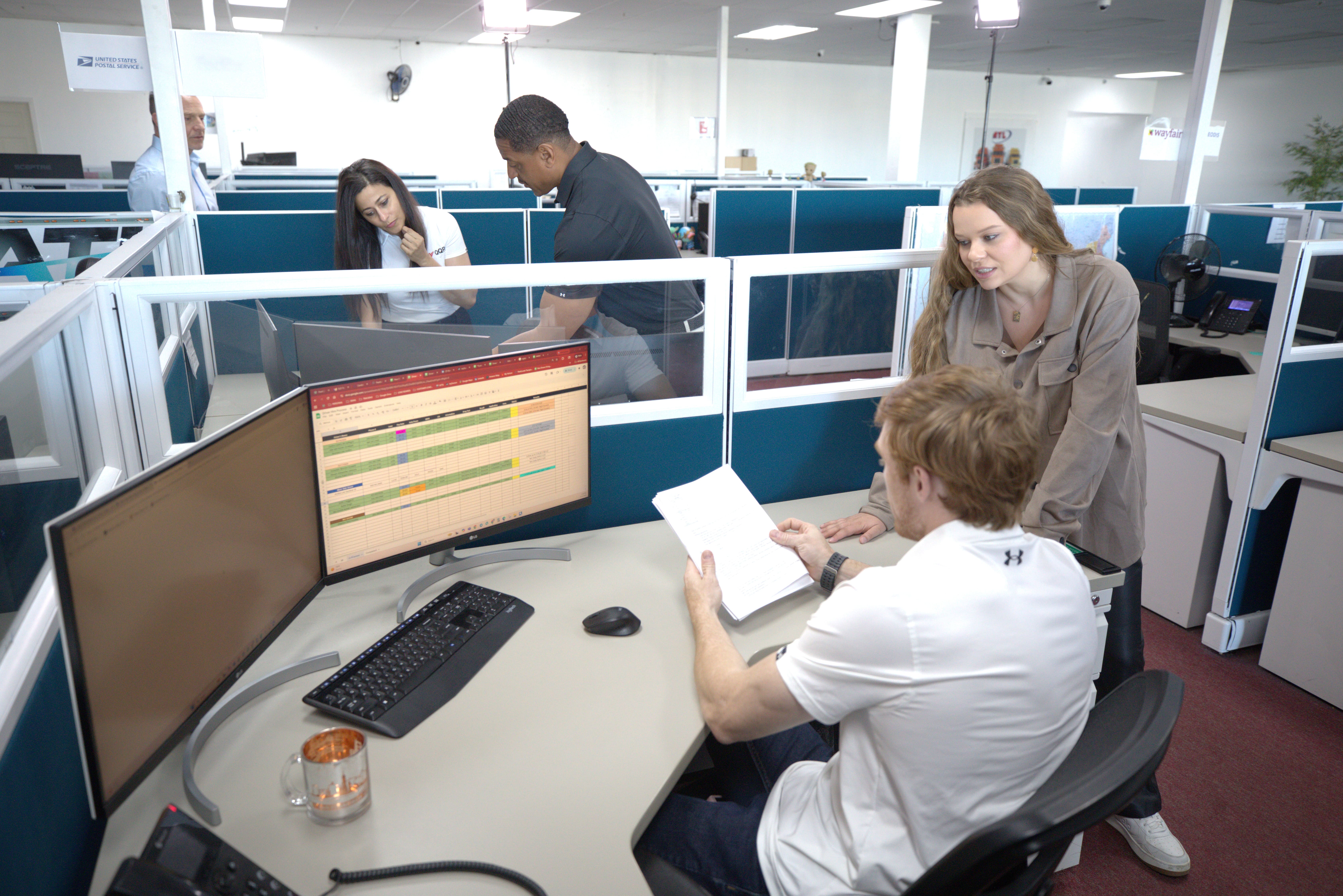 QQR carrier support representative on the phone at her desk
