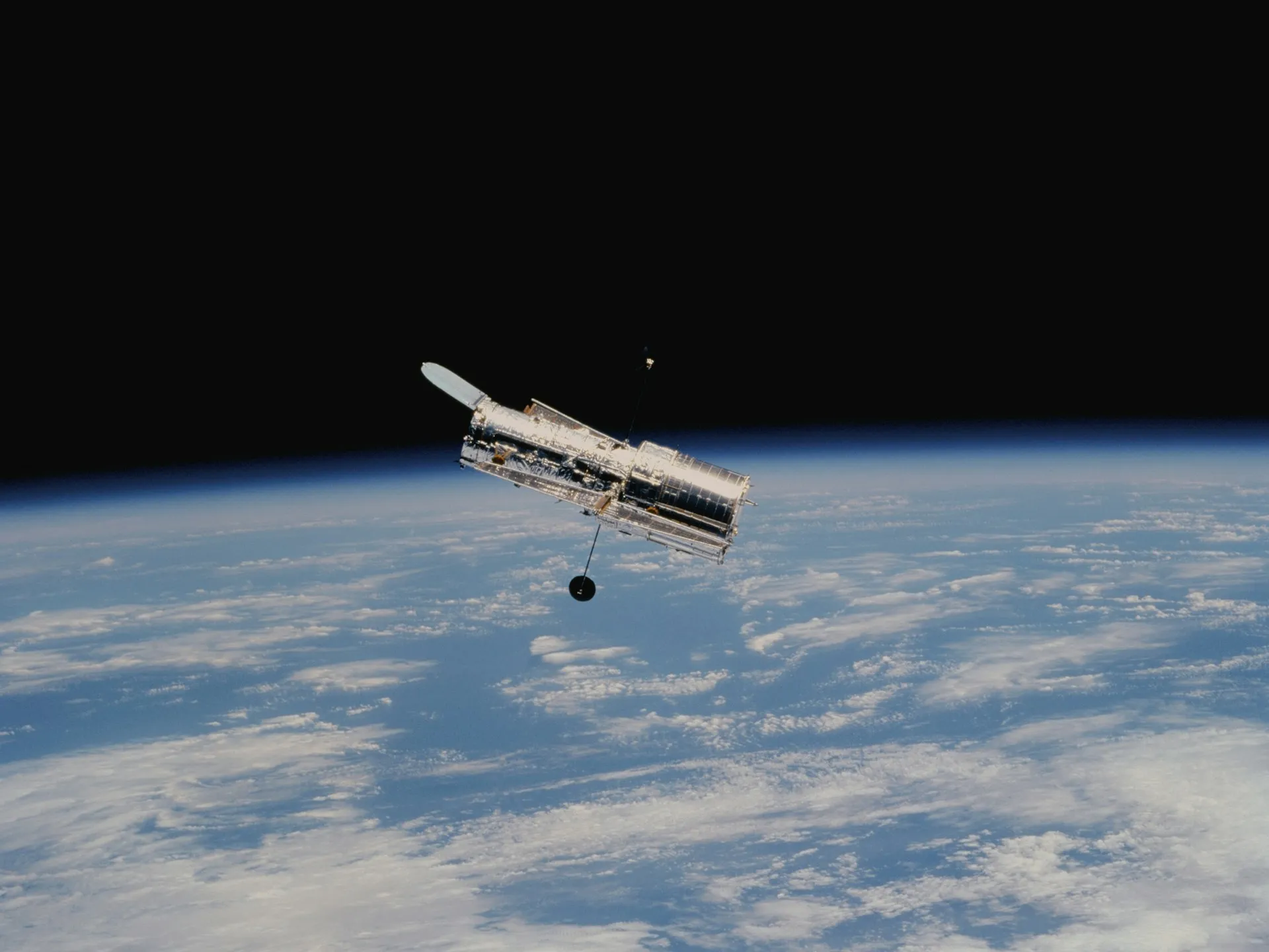 Satellite in space floating above earth