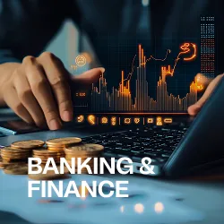 Hand touching laptop keyboard with digital financial charts and stacked coins, labeled Banking & Finance.