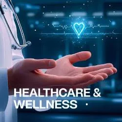 A doctor’s hand extended with a glowing blue heart and heartbeat line graphic above, symbolizing healthcare and wellness.