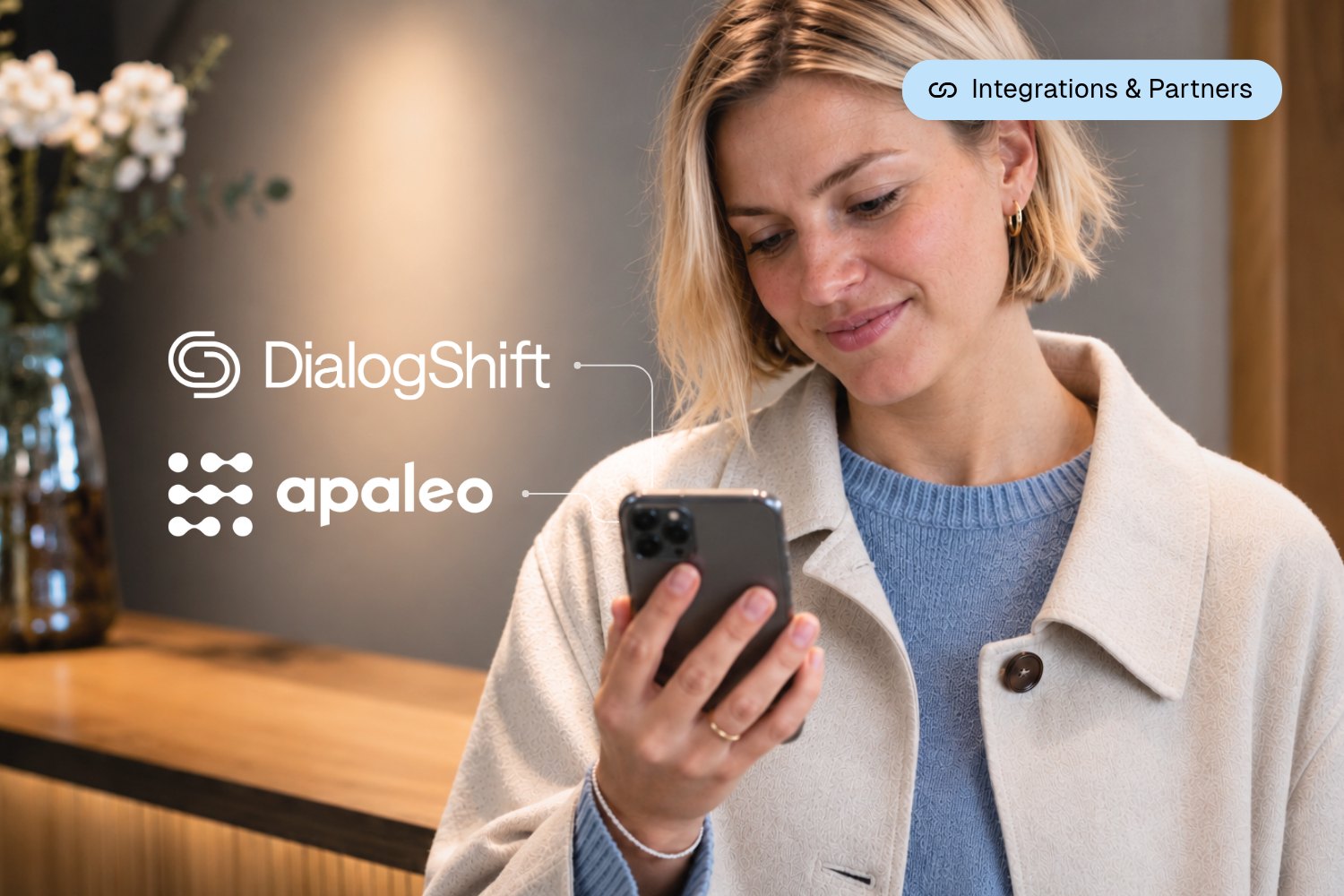 Hotel guest booking on a smartphone in the hotel lobby via DialogShift, connected to the apaleo PMS