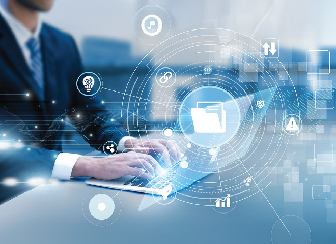 Businessman typing on a laptop with digital icons representing data and technology floating above the keyboard.