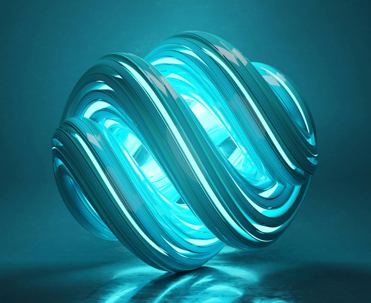 Two people sitting at a table with a laptop.