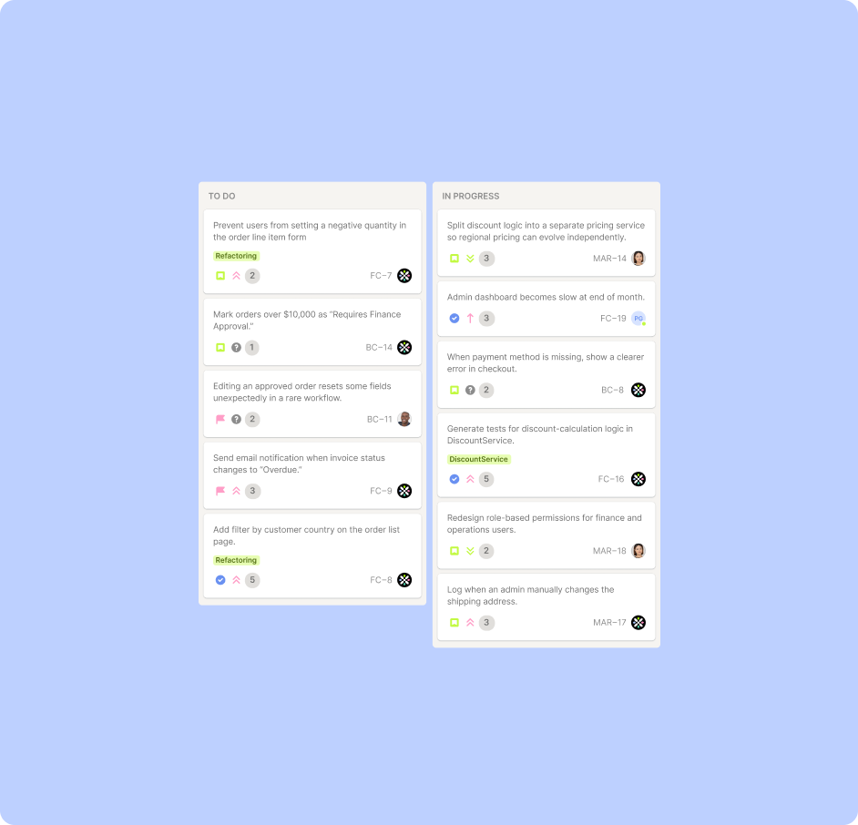 Two people sitting at a table with a laptop.