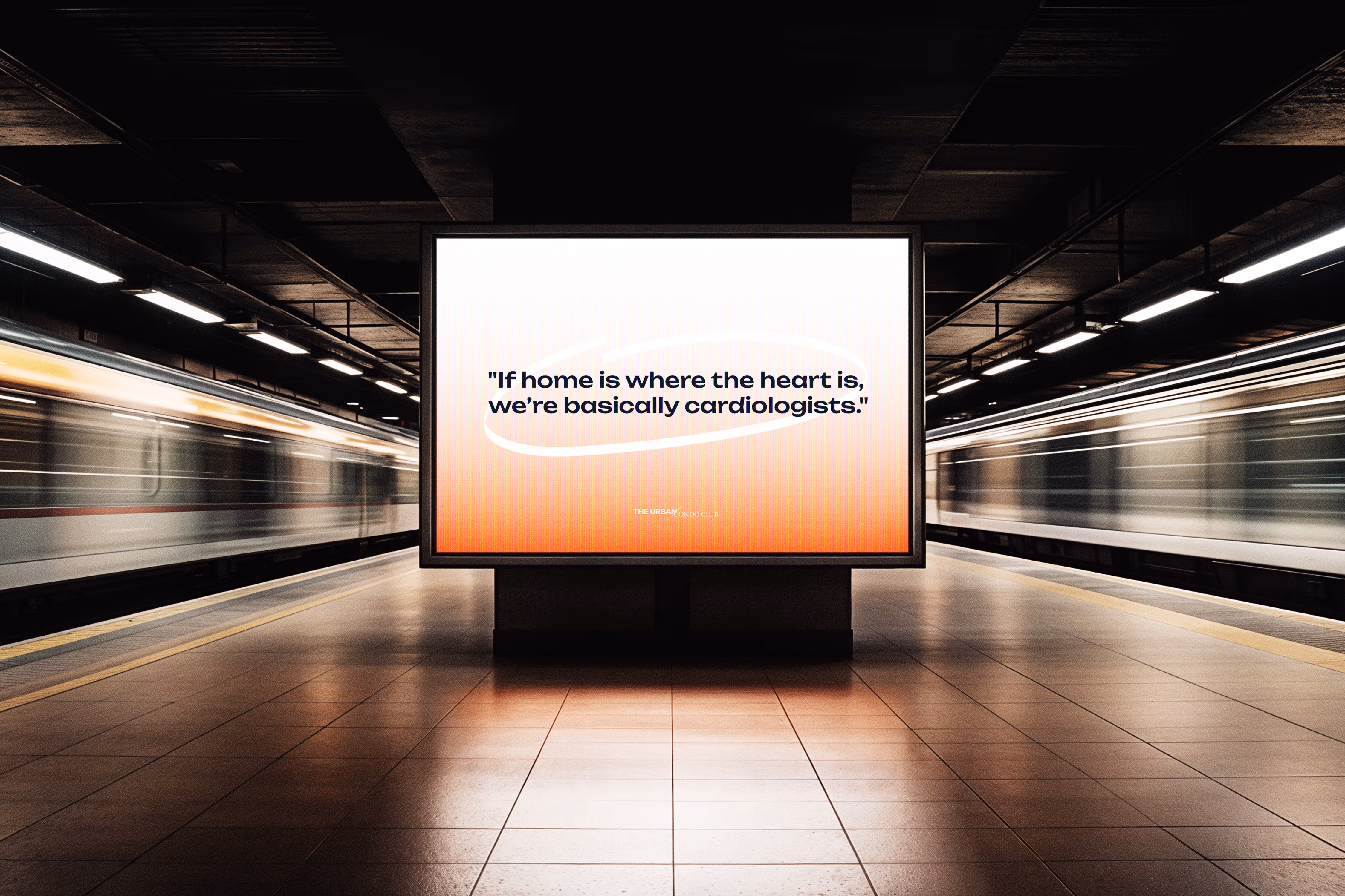 Subway platform with two trains in motion and a large digital billboard displaying the quote, "If home is where the heart is, we’re basically cardiologists." A campaign we did for the urban condo club