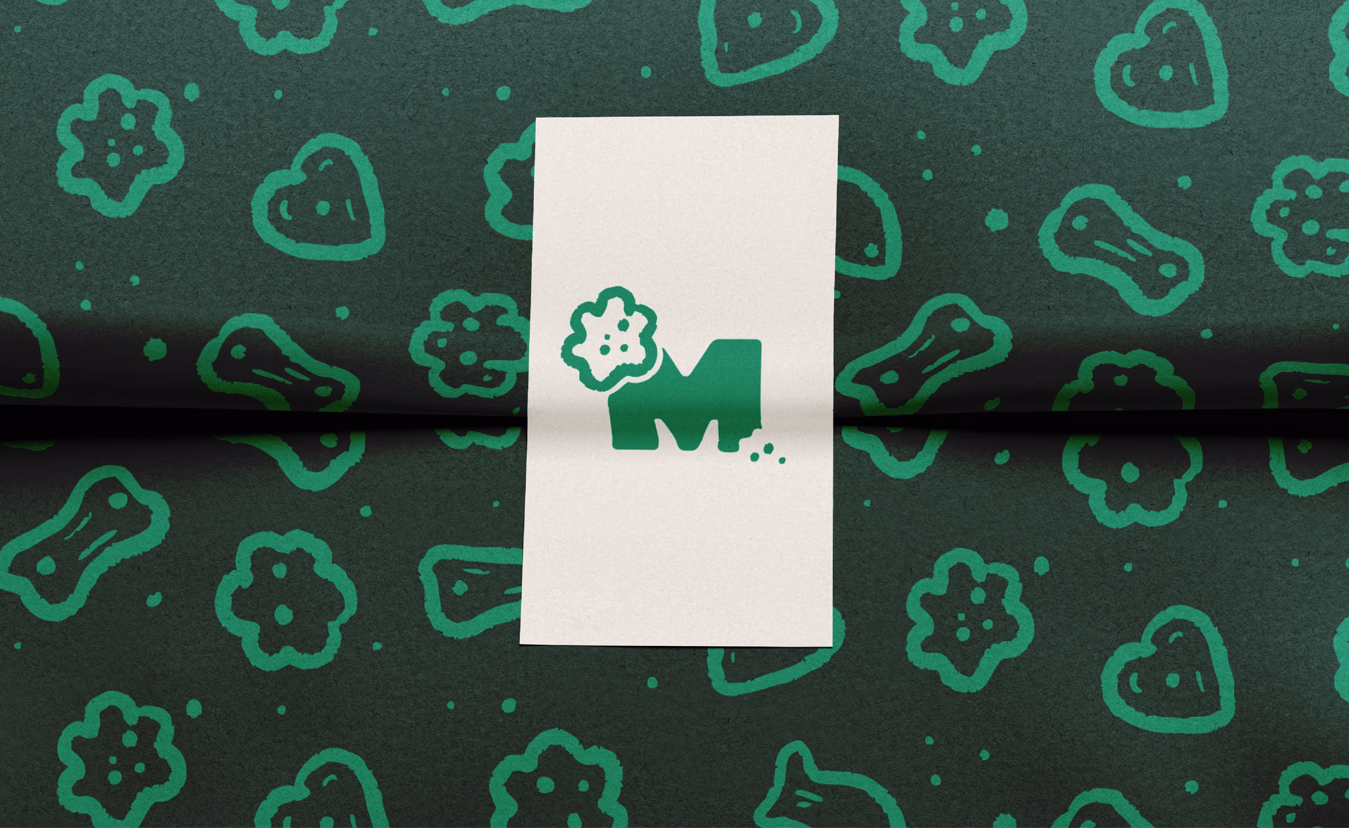Packaging with the pattern made of dog treats in various shapes for the company mampfi, a dog food company.