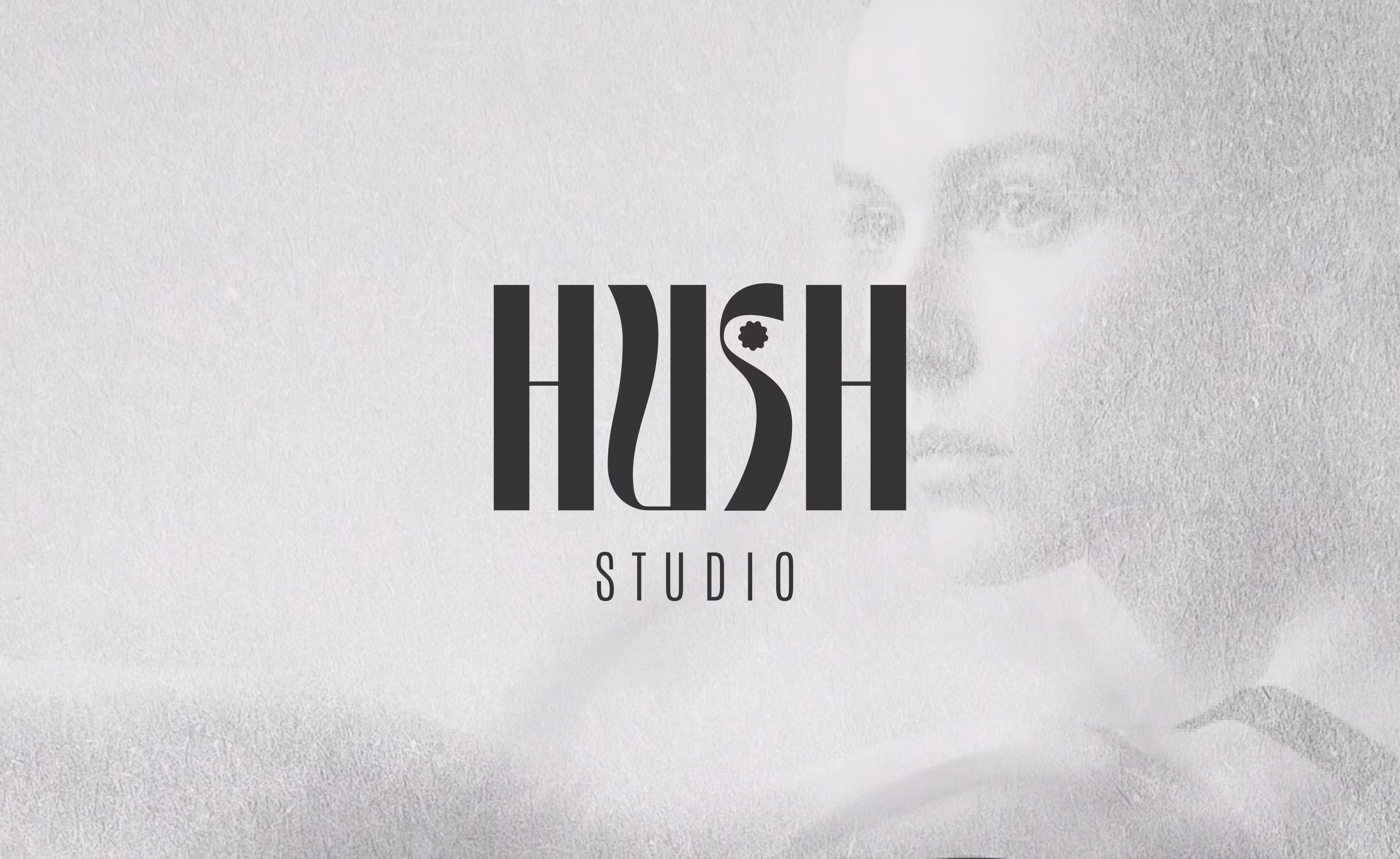 Logo design for ‘Hush Studio’ overlaid on a grayscale, textured background with a faint image of a contemplative woman's face on the right.