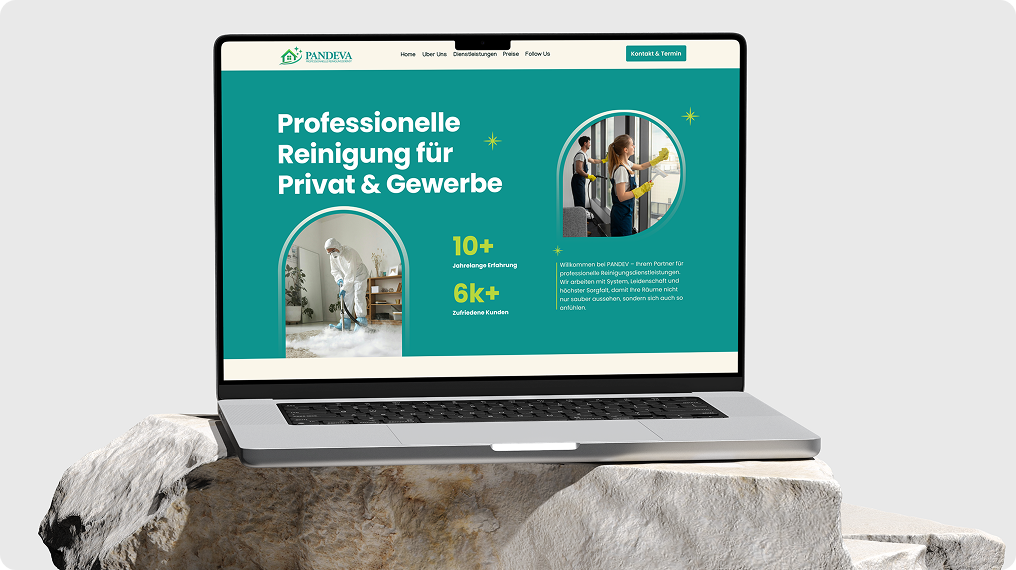 Laptop displaying a cleaning service website in German with images of workers cleaning a room and a window.