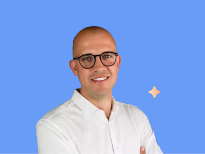 Professional headshot of Martin in a white shirt