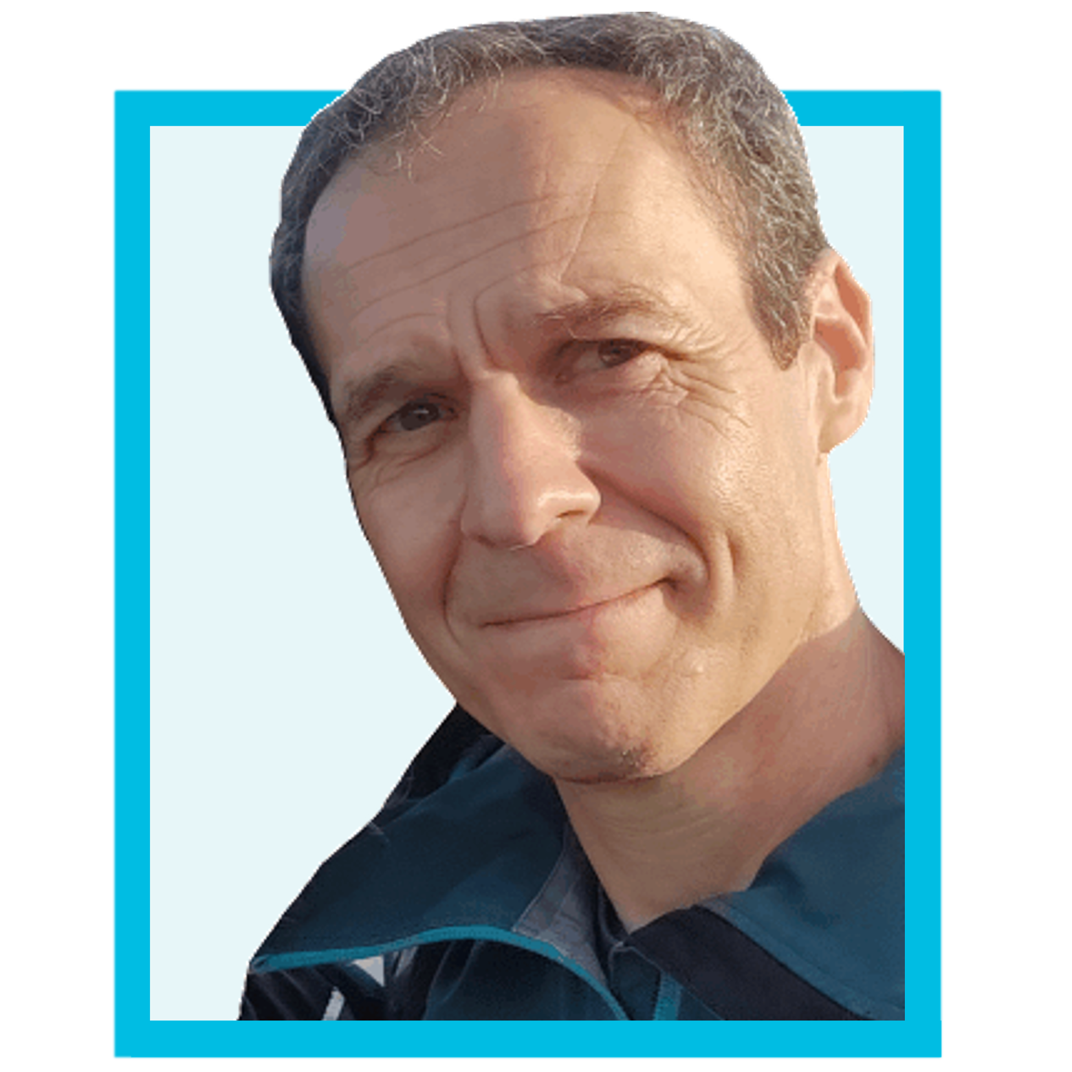 Middle-aged man with short greying hair wearing a blue jacket, smiling slightly against a light background with a bright blue border.