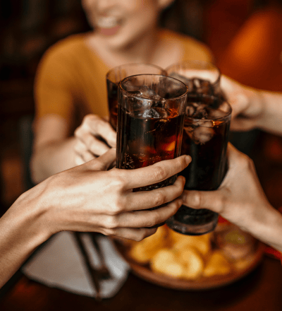 people cheers glasses