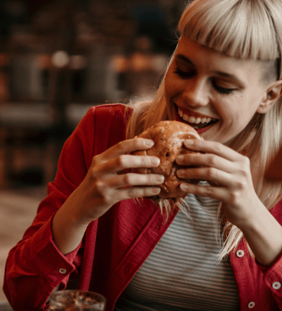 women eating a burger