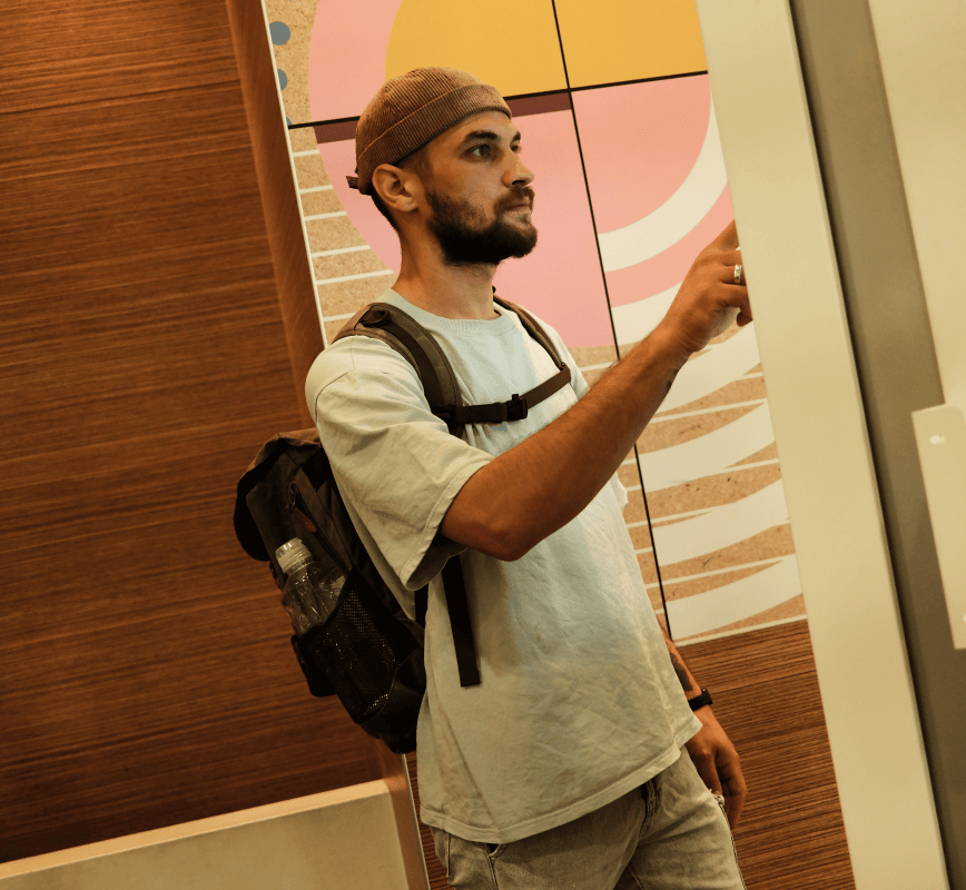 Stock image of a man at a ordering kiosk