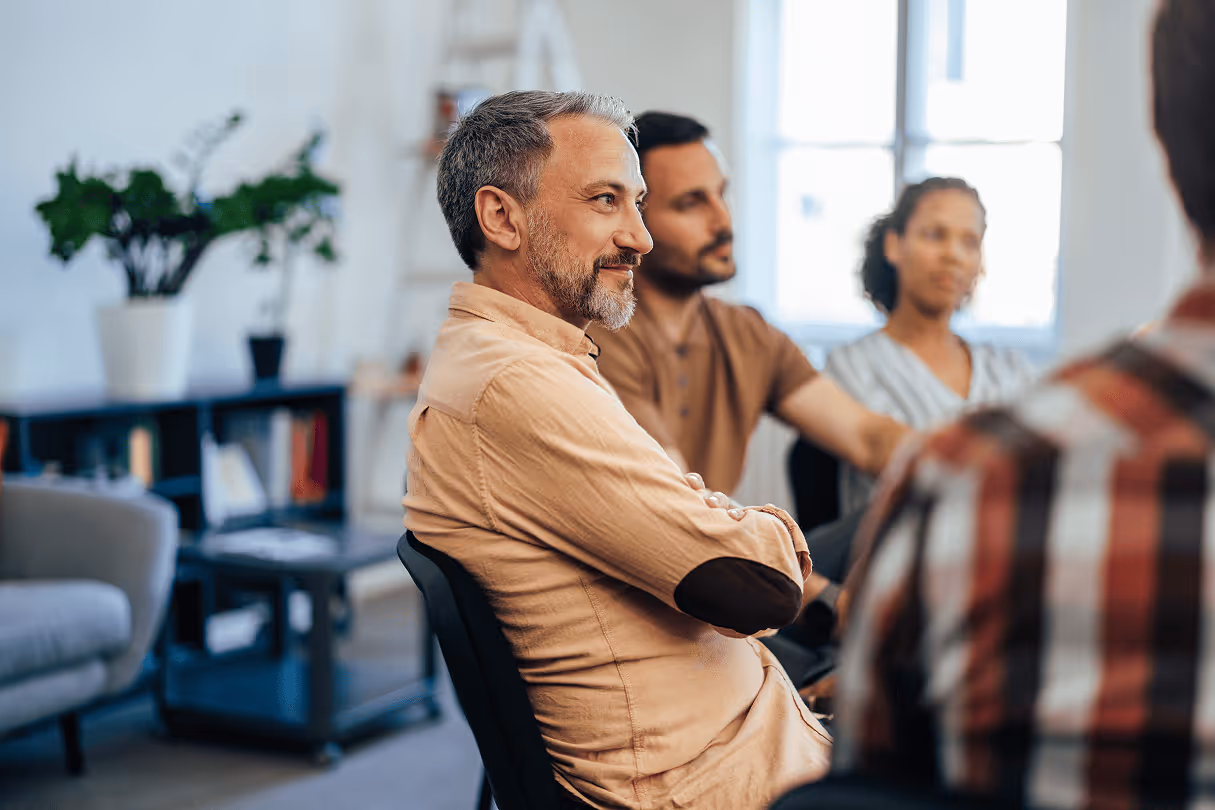 Stock image of a man sitting at a table