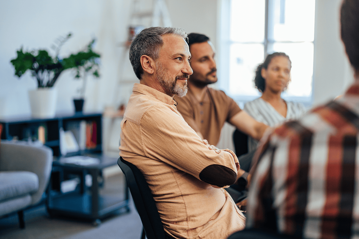 Stock image of a man sitting at a table