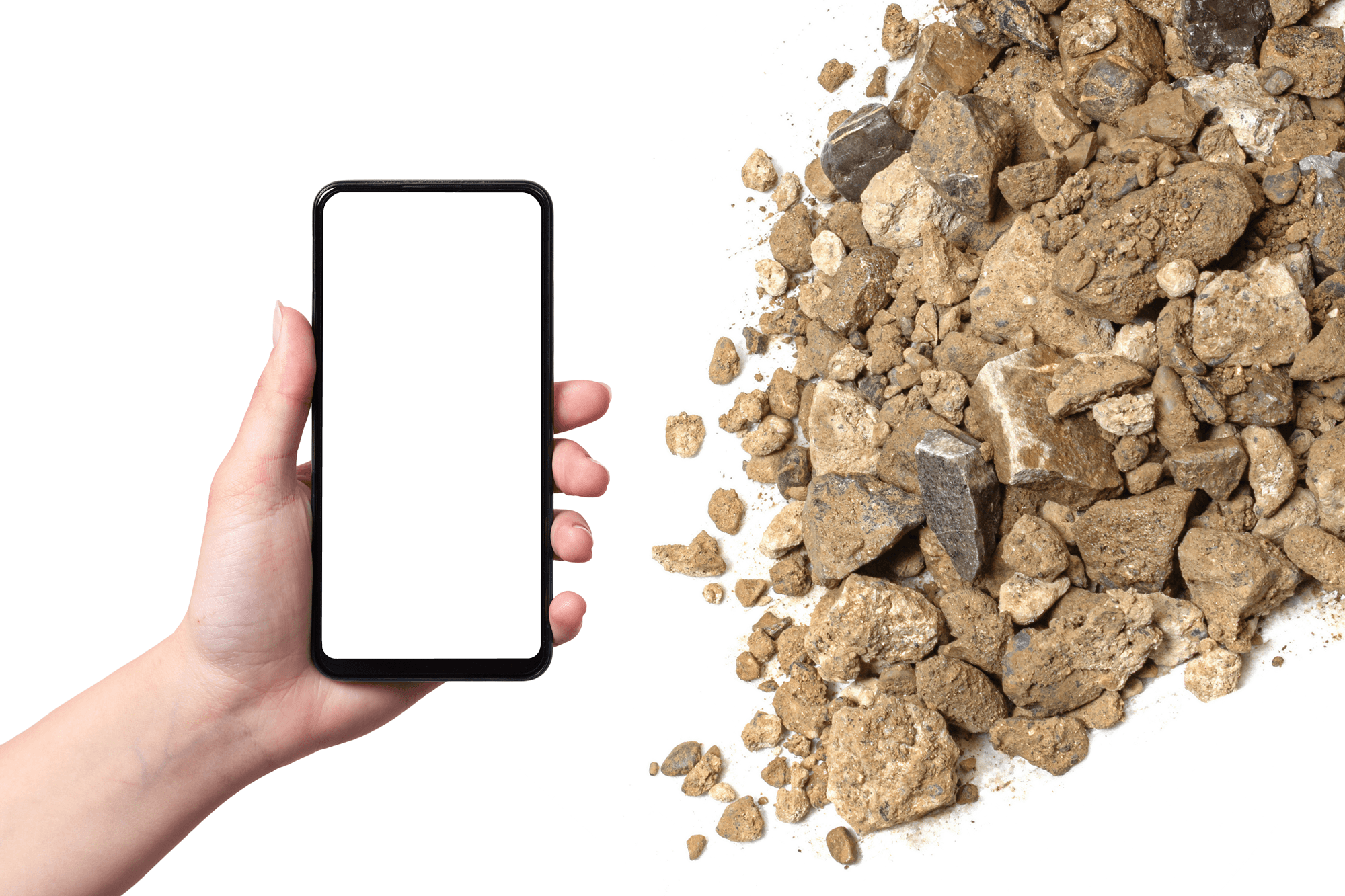Hand hält ein Smartphone mit leerem weißen Bildschirm neben einem Haufen brauner trockener Erde und Steine.