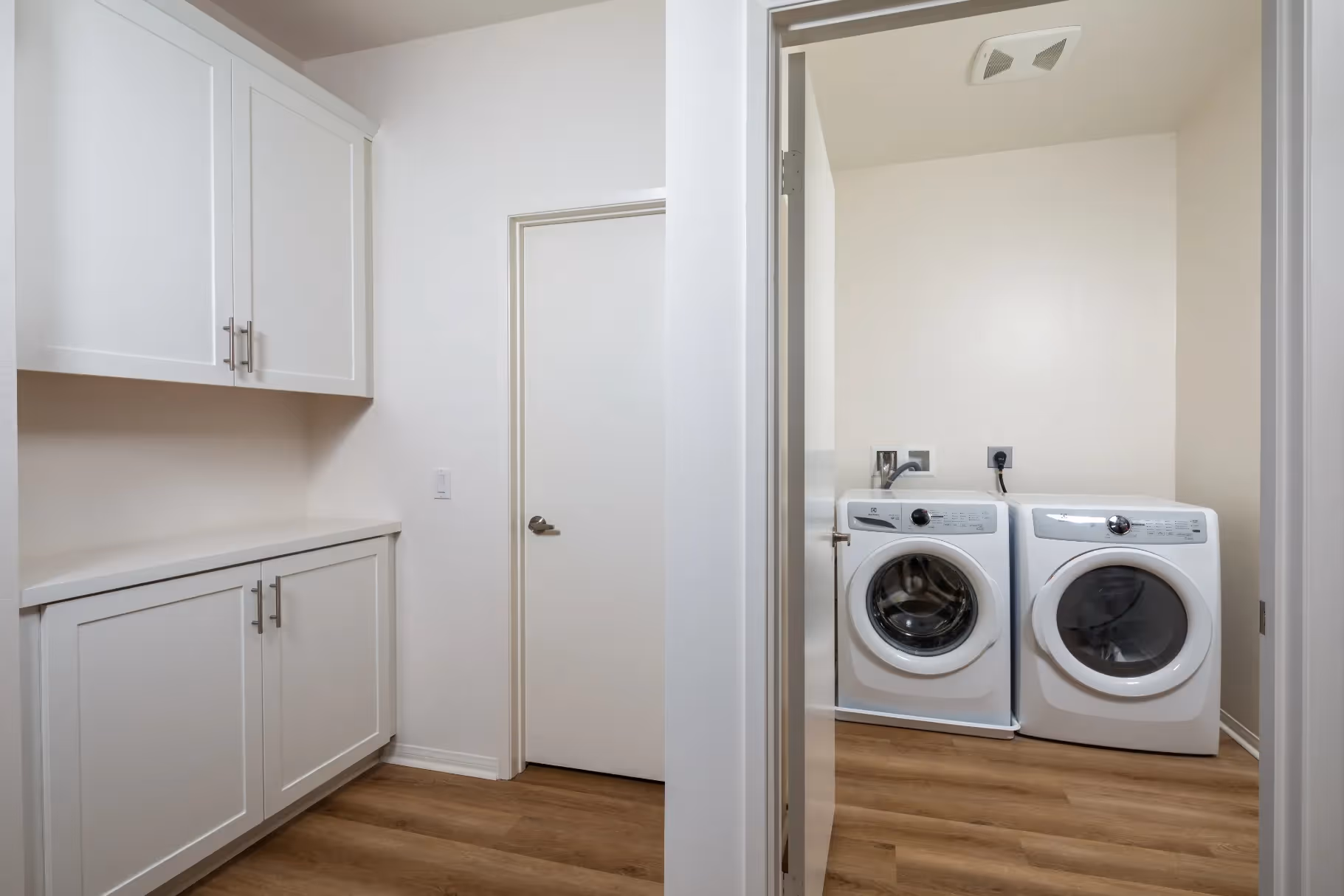 laundry closet with white appliances