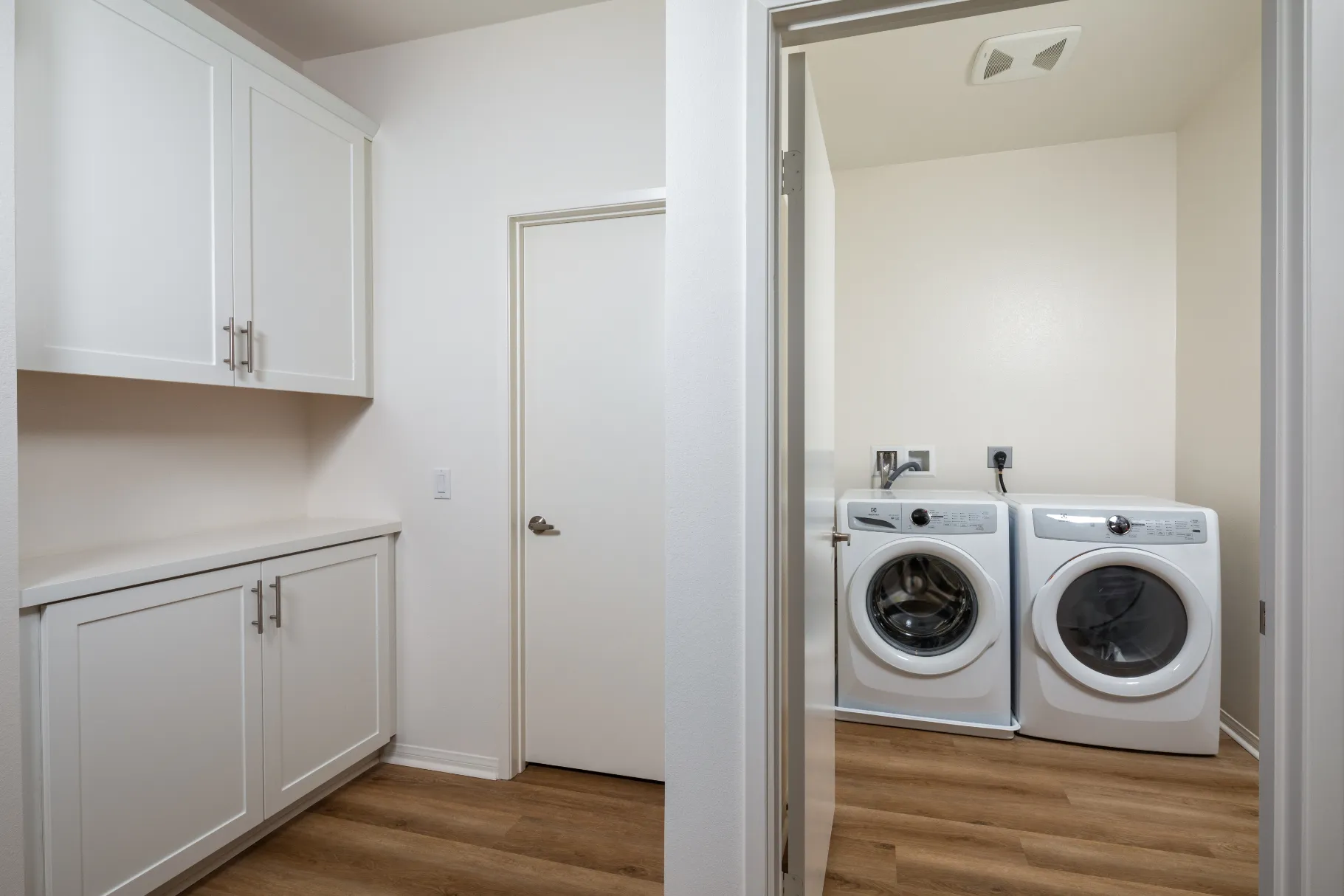 laundry closet with white appliances