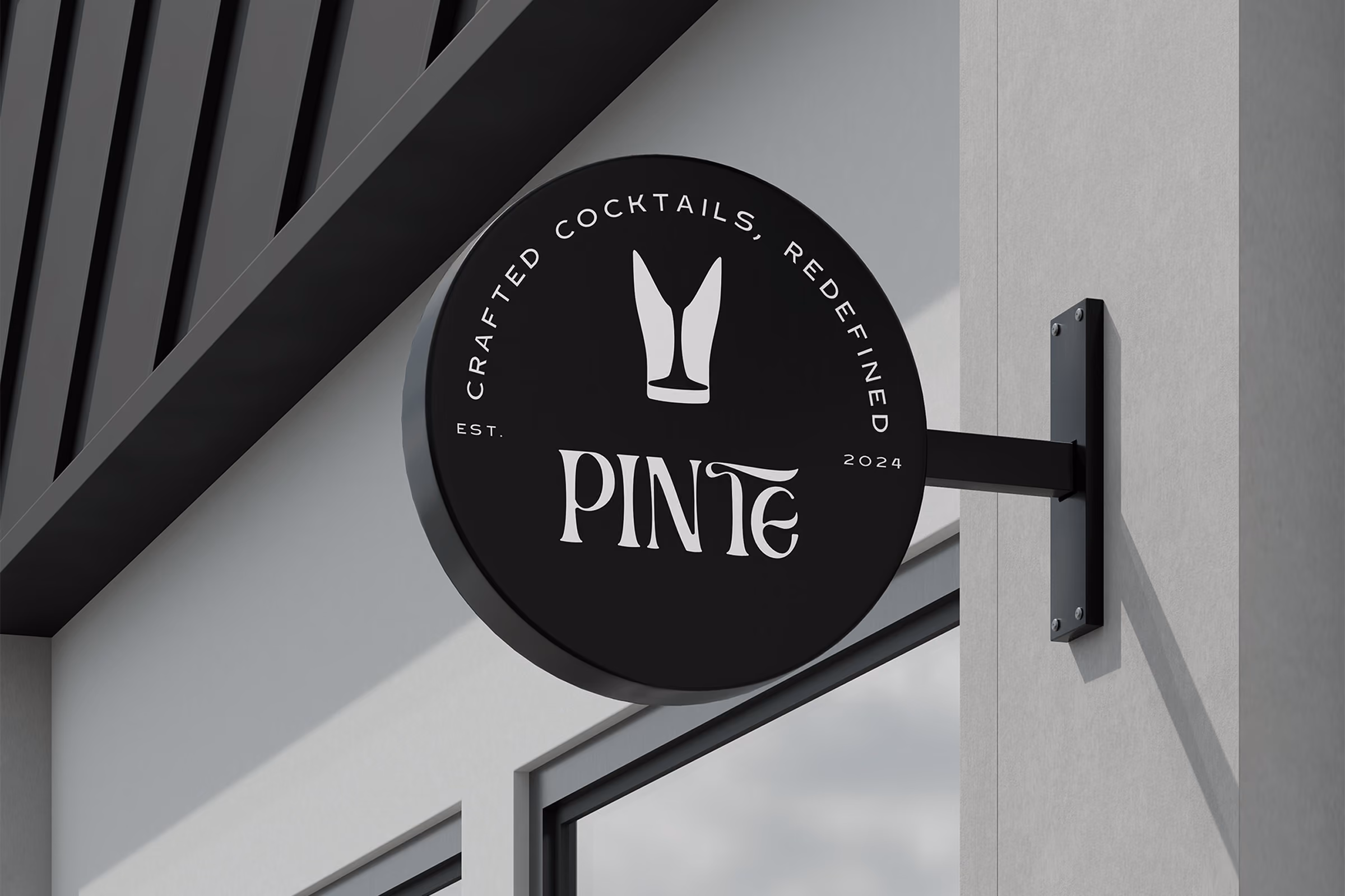 Circular Pinte hanging sign on a building exterior