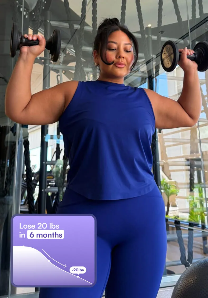 Girl in Blue Fitness Suit with Dumbbells