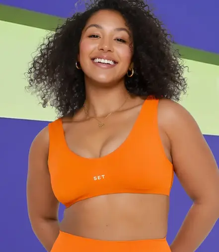 Girl in orange fitness suit