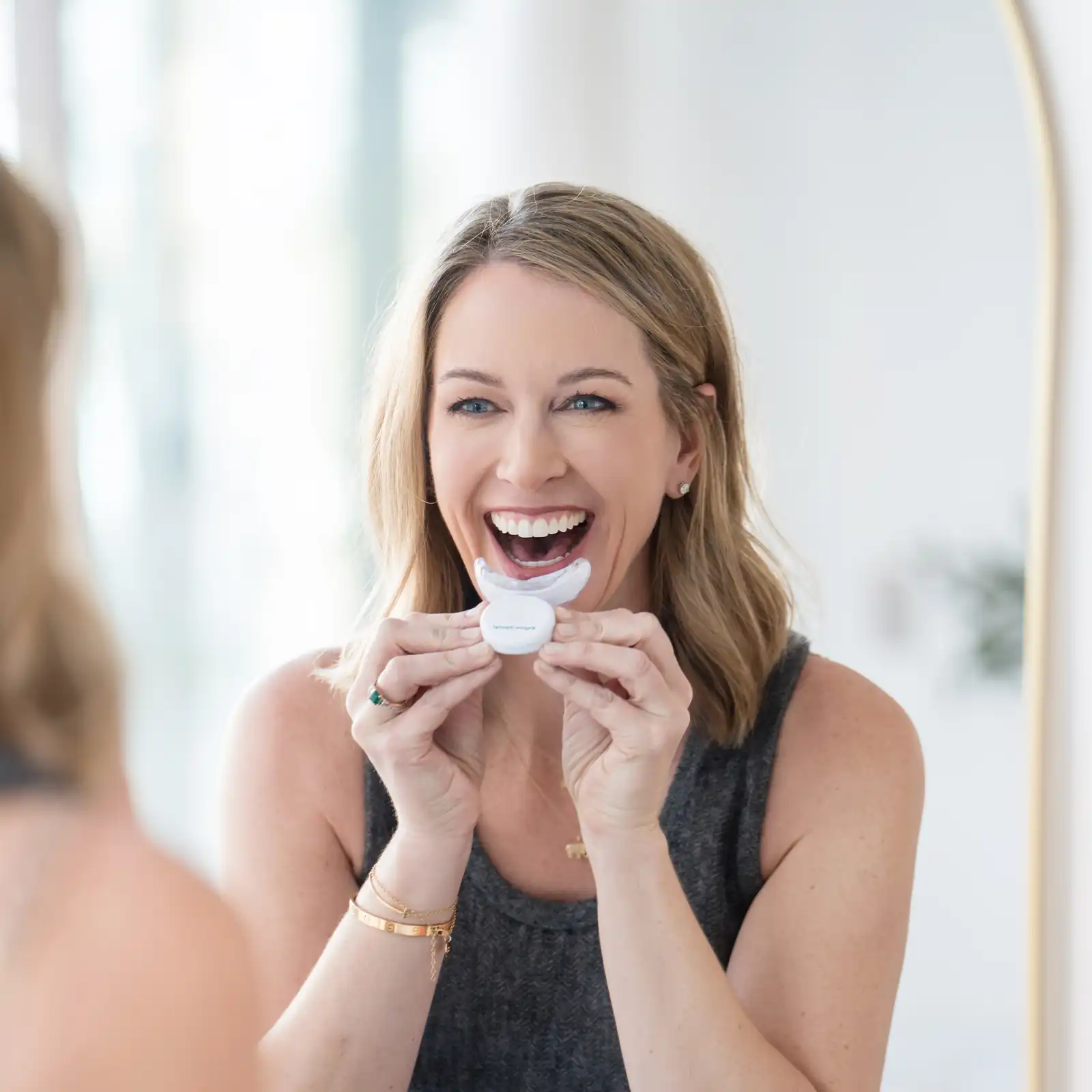 A patient undergoing professional teeth whitening treatment at Tranquility Dental Wellness in Lacey, WA.