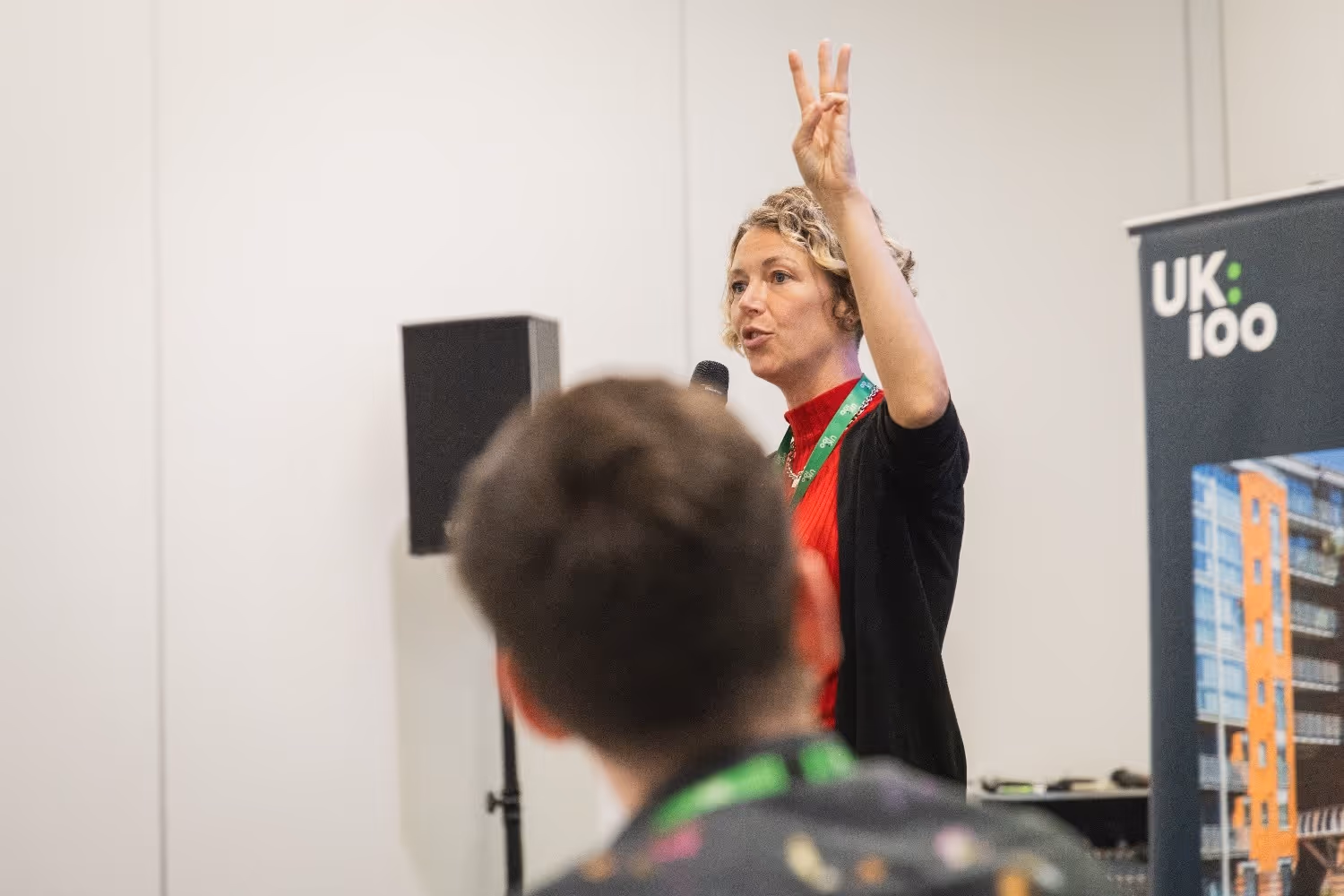 ACT Climate Labs founder and misinformation expert Harriet Kingaby talks to UK100 participants at the Climate Leadership Academy in Manchester 2024