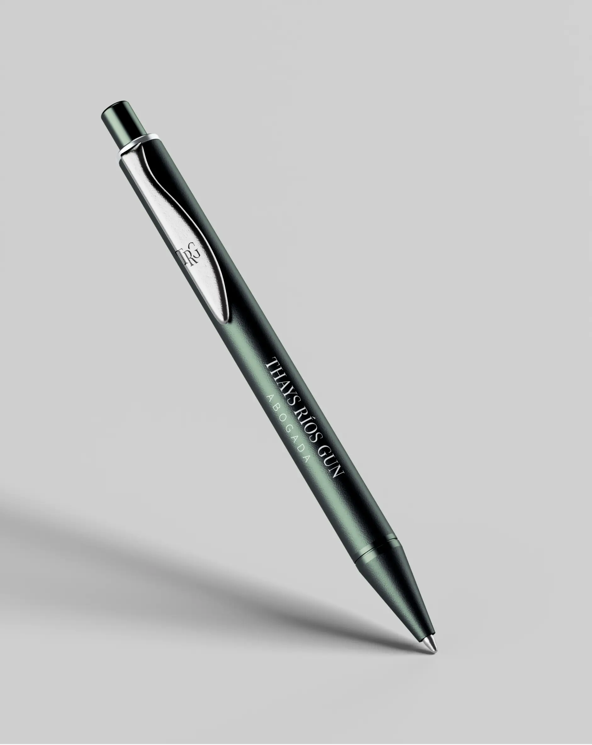 Matte dark green corporate pen branded with the white Thays Rios Gun Abogada logo text floating against a clean grey background.