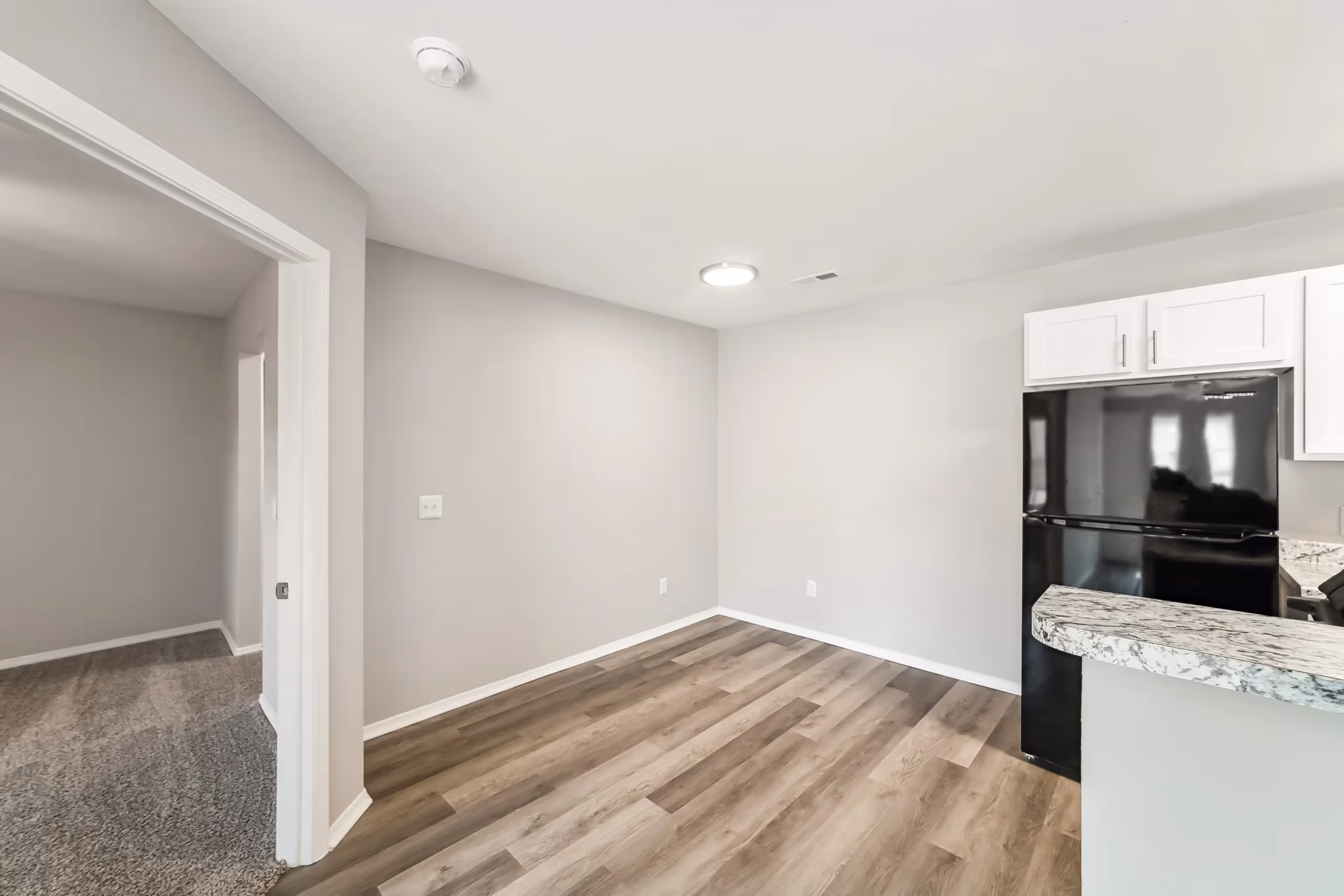 unfurnish dining room next to kitchen