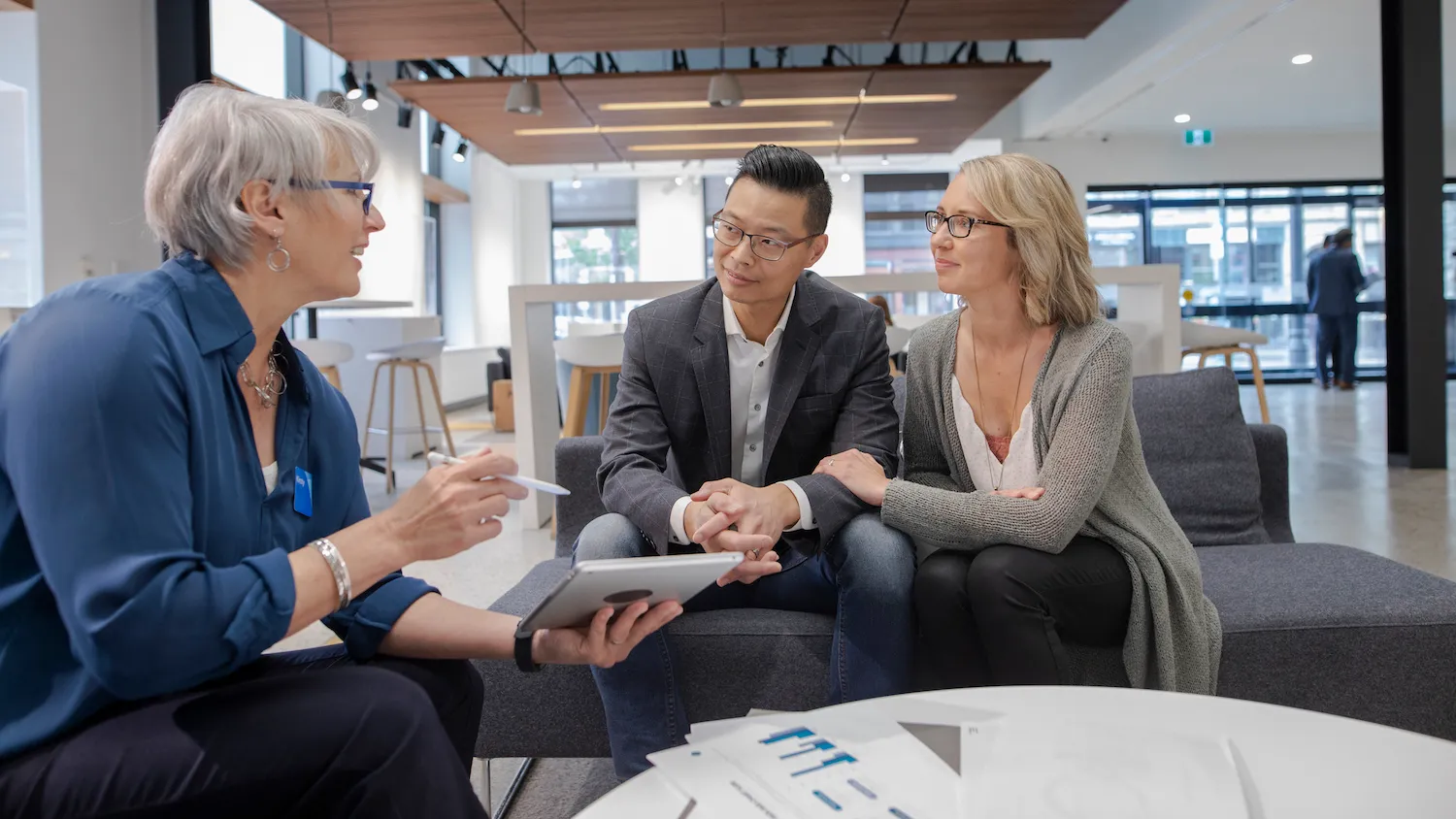 Homebuyer reviewing a mortgage Loan Estimate document on a desk in Seattle