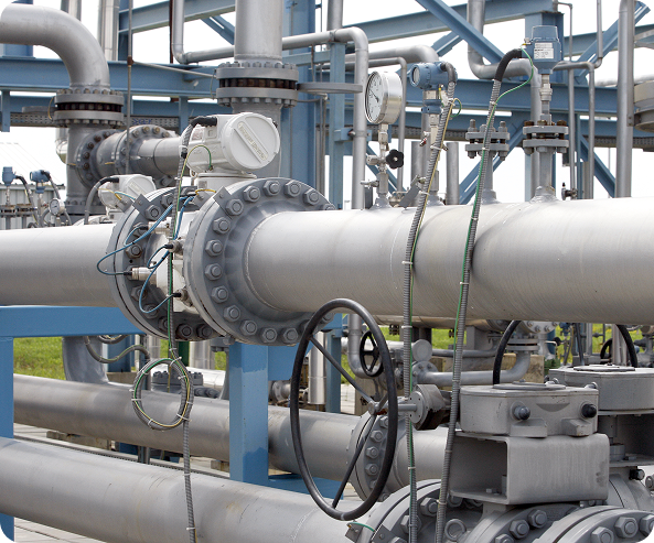Industrial pipeline and valve infrastructure representing MetSolv's metering support management services