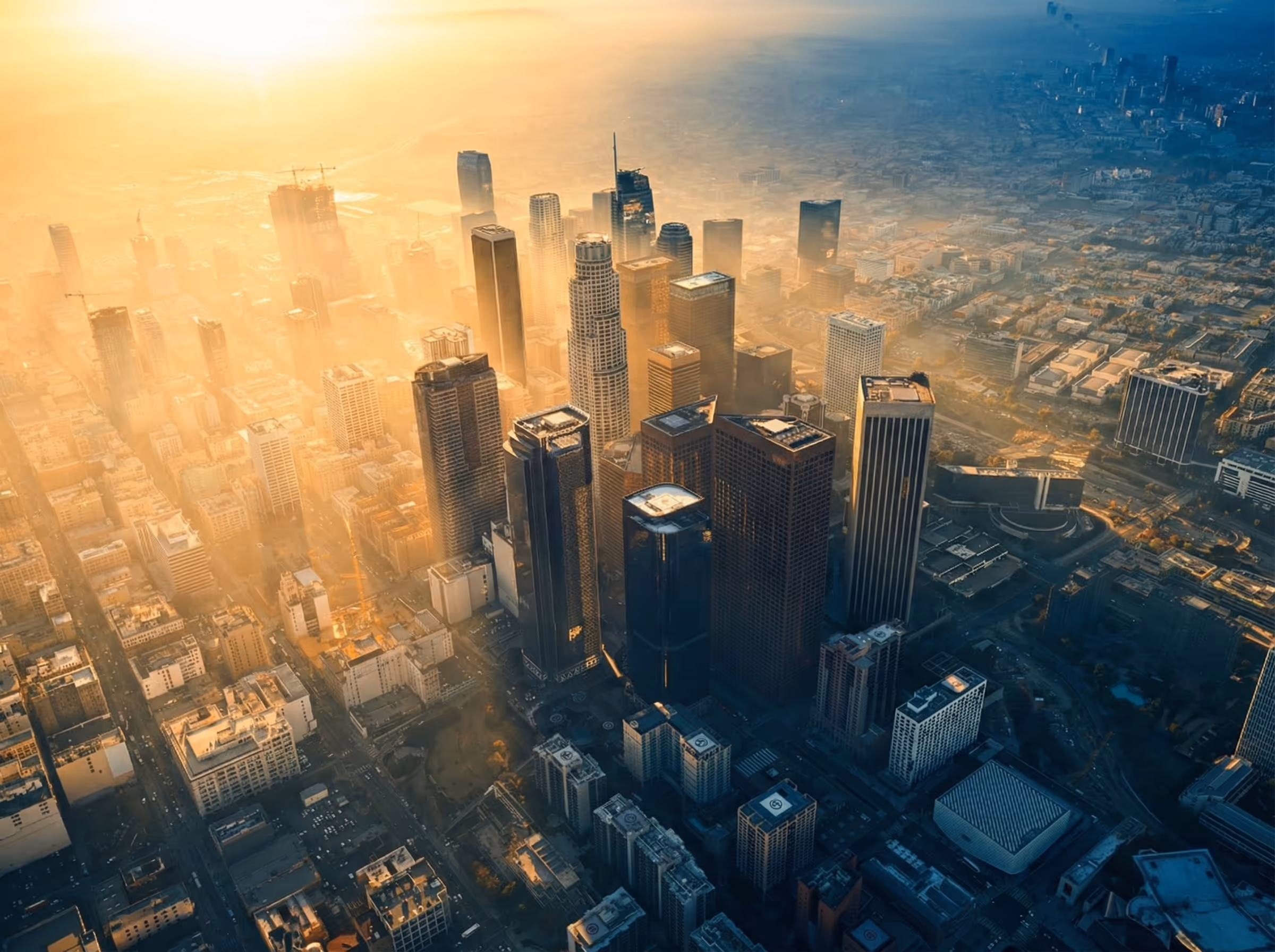 Aerial view of a modern city with high-rise buildings and active streets