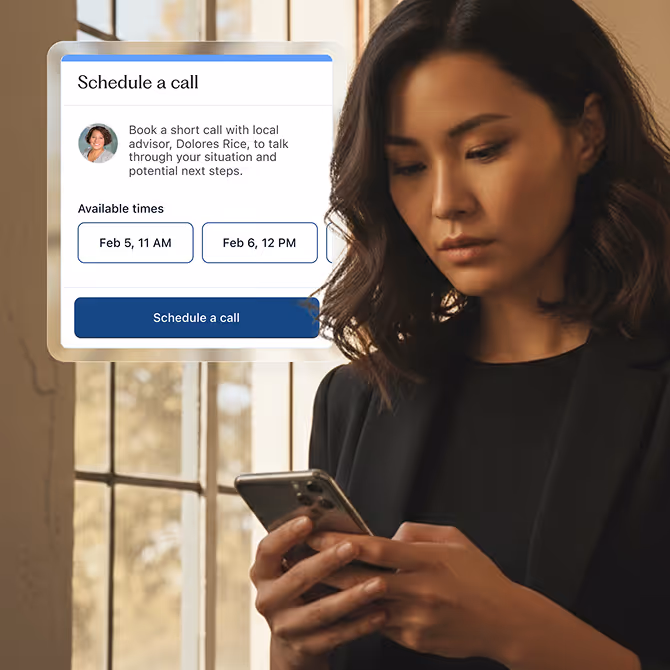 A woman wearing black using her phone