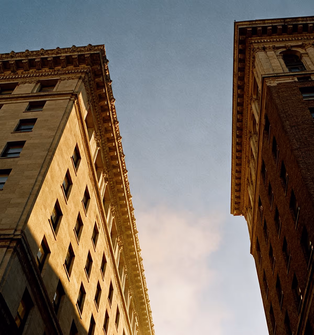 A photo of the sky and two buildings