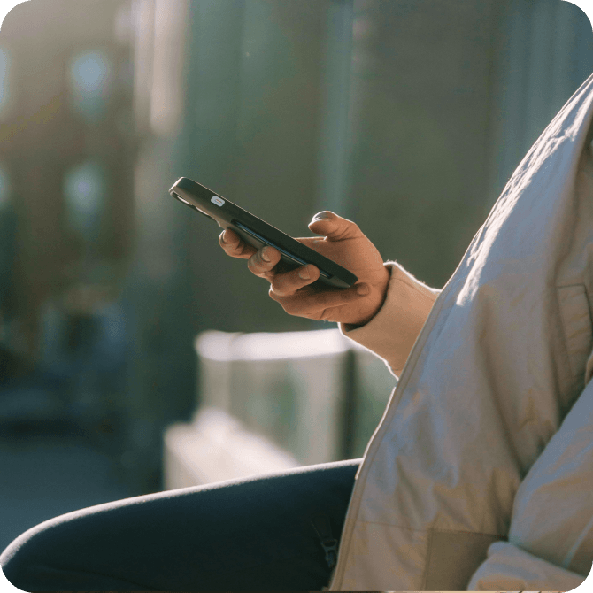A hand holding a phone