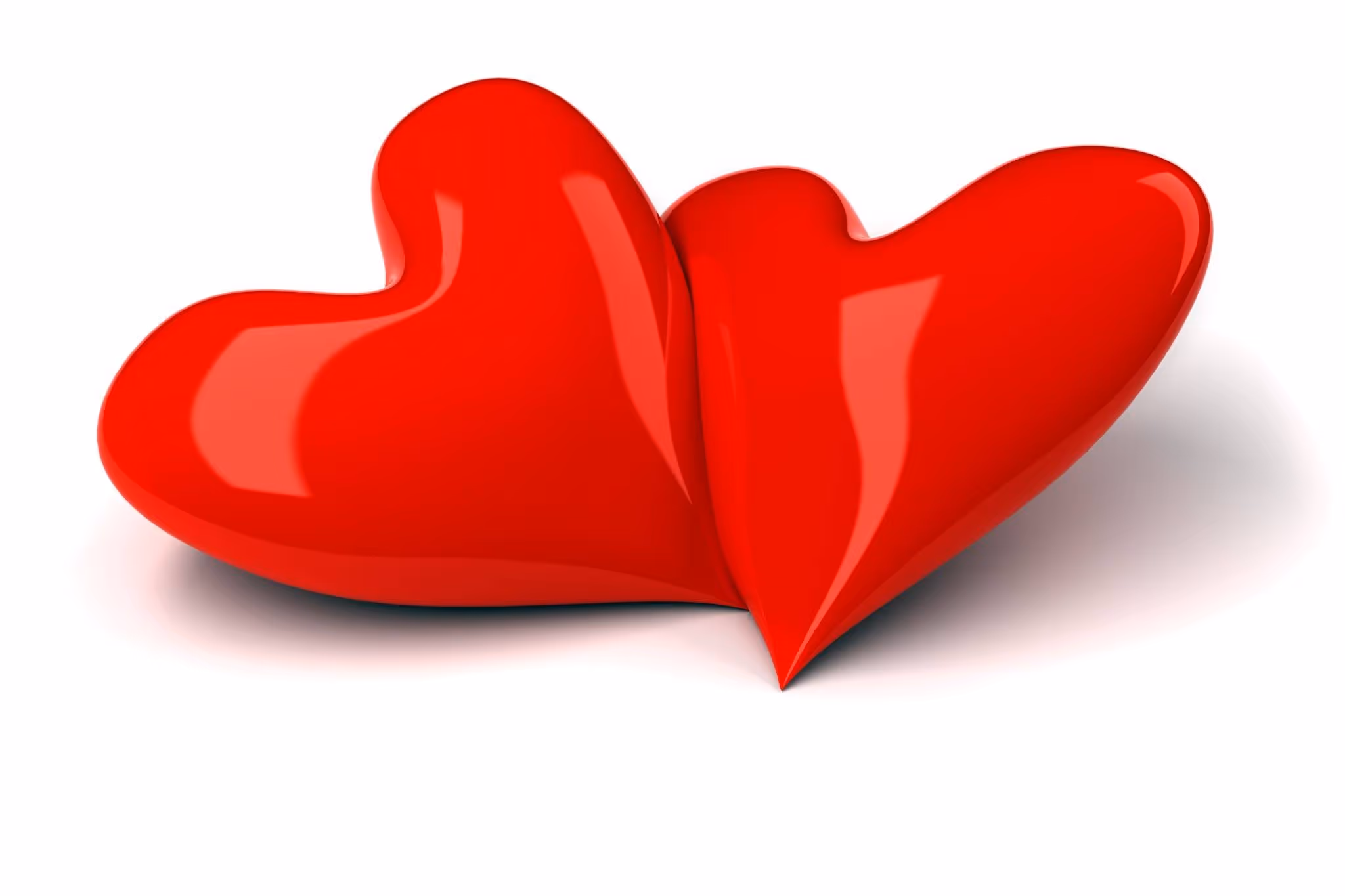 Two shiny red hearts overlapping on a white background.